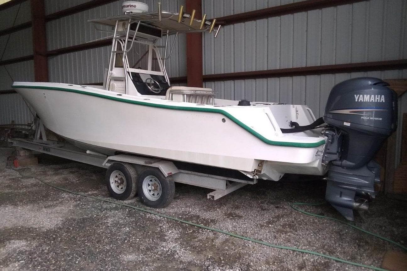 1996 Mako 262 Center Console boat with Yamaha outboard motor on trailer.