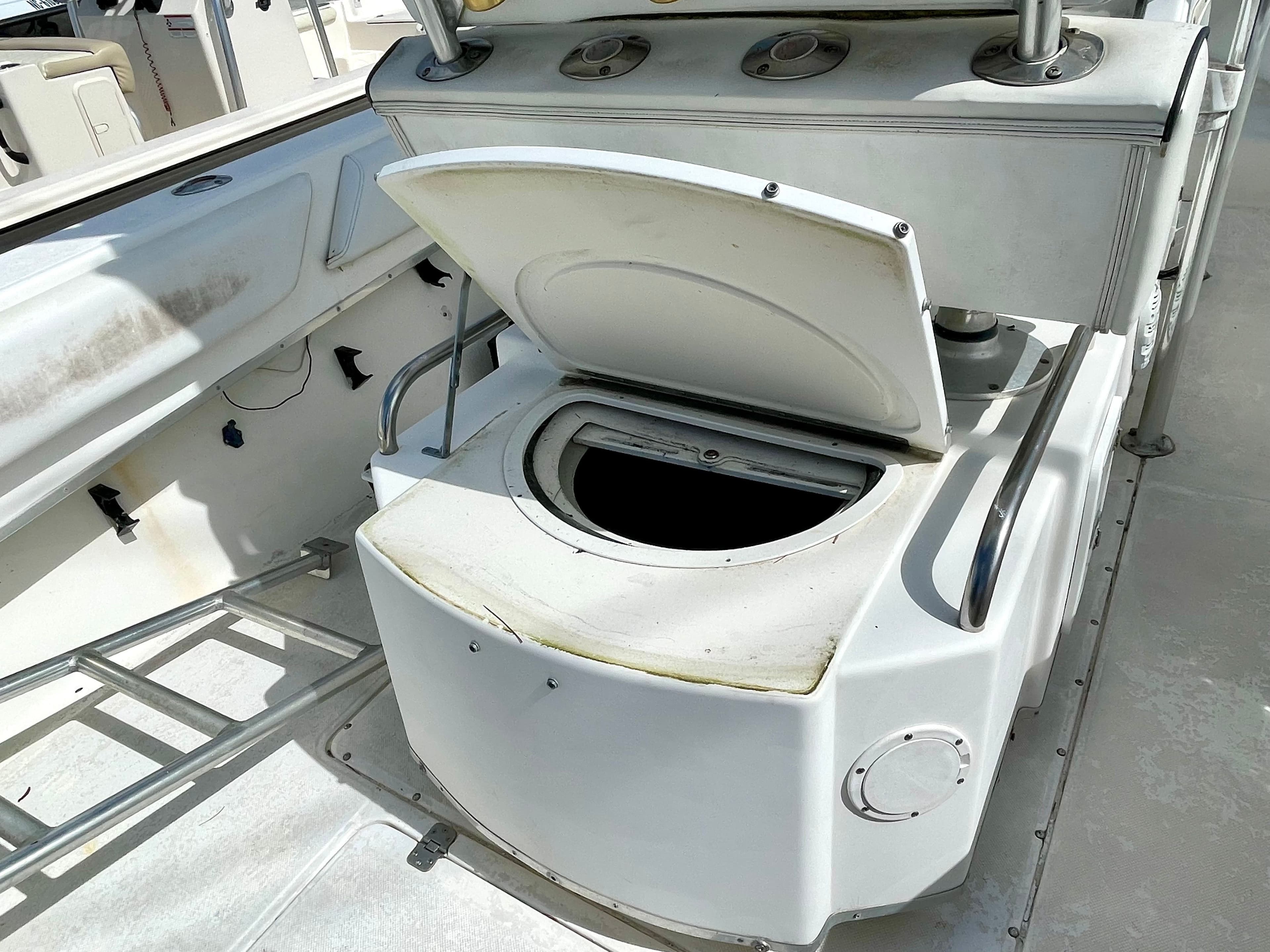 Open storage compartment on a 2000 Fountain 25 Sport Fish boat.