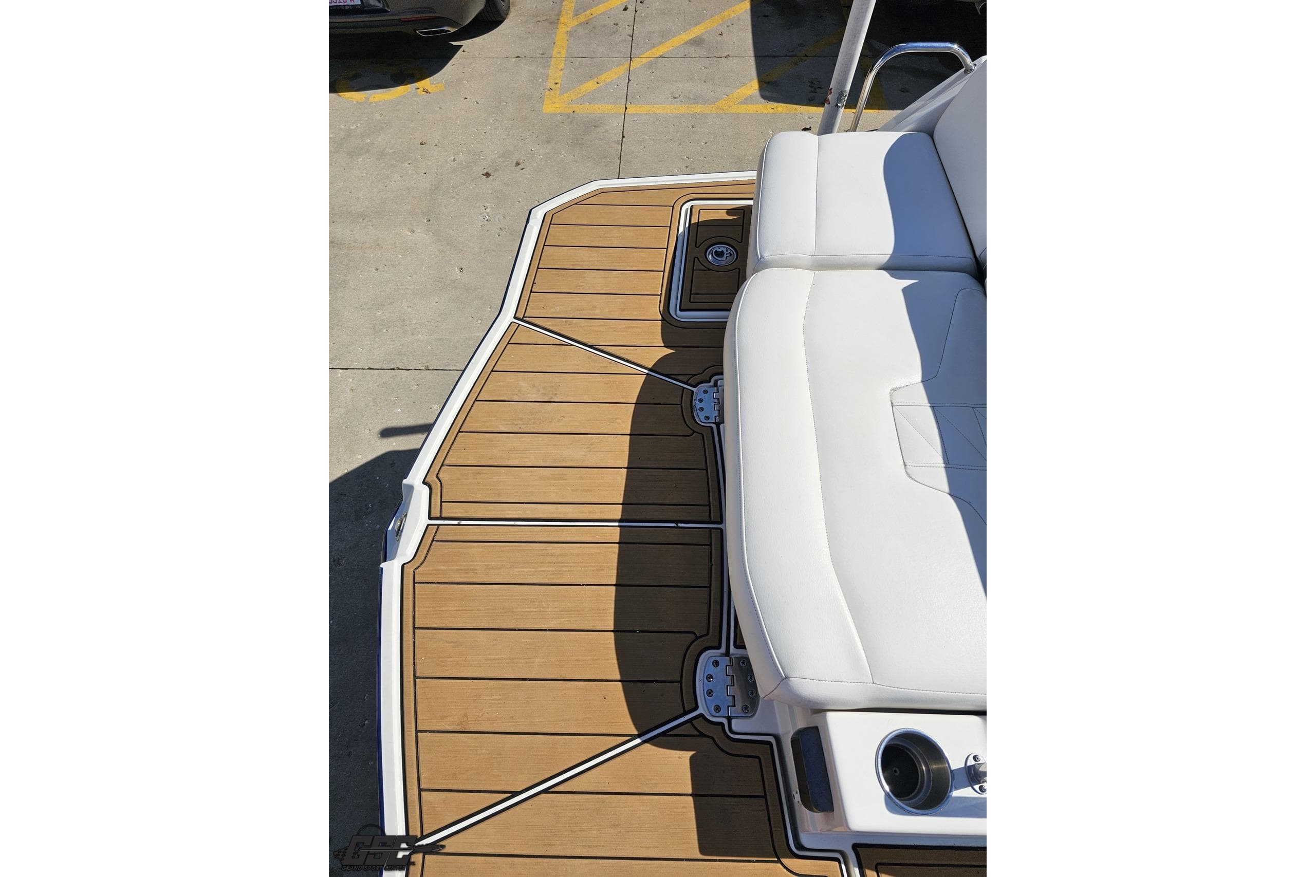 2013 Monterey M3 Sport Boat deck with white seating and wood-style flooring.