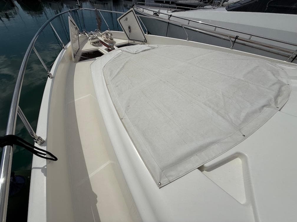 Ferretti Yachts 690, 2012 model, deck view with sunshade and railing.