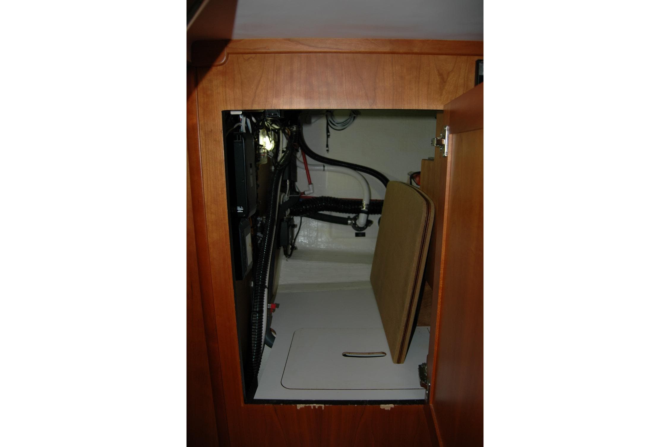 2019 Sabre 38 Salon Express interior storage compartment with wiring and equipment.