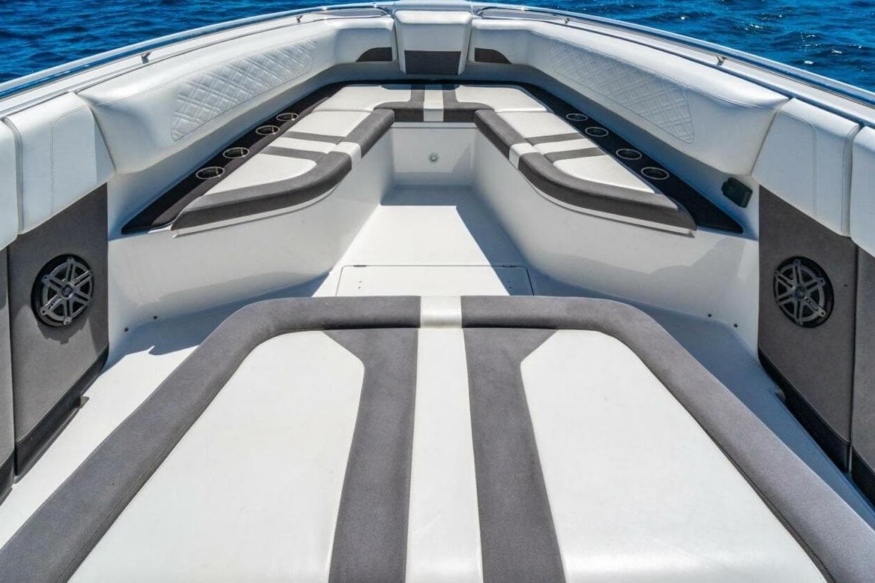 2019 Cigarette 41' GTR boat interior with cushioned seating and cup holders on open water.