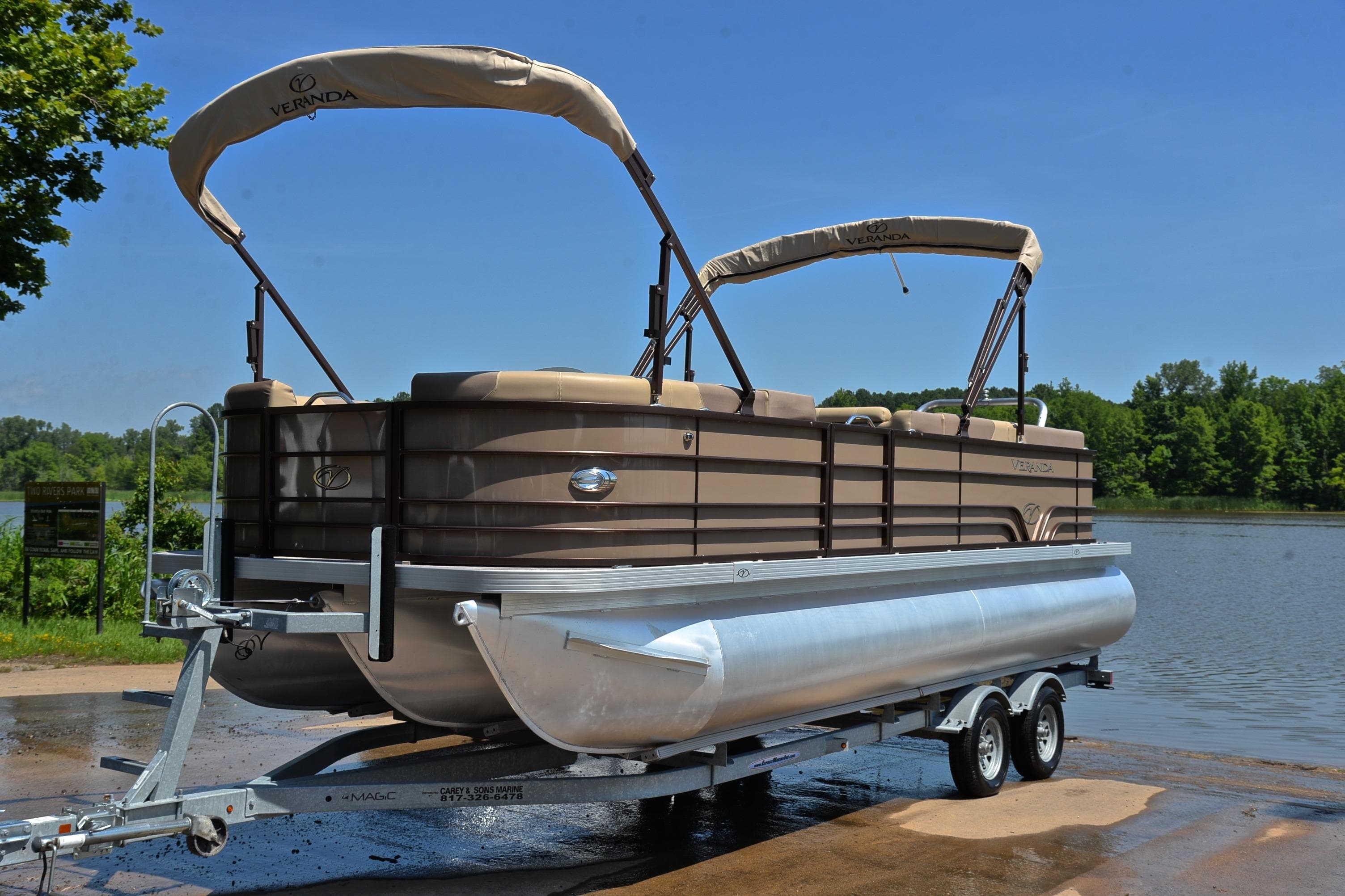 2020 Veranda VR22 pontoon boat on trailer by a lake.