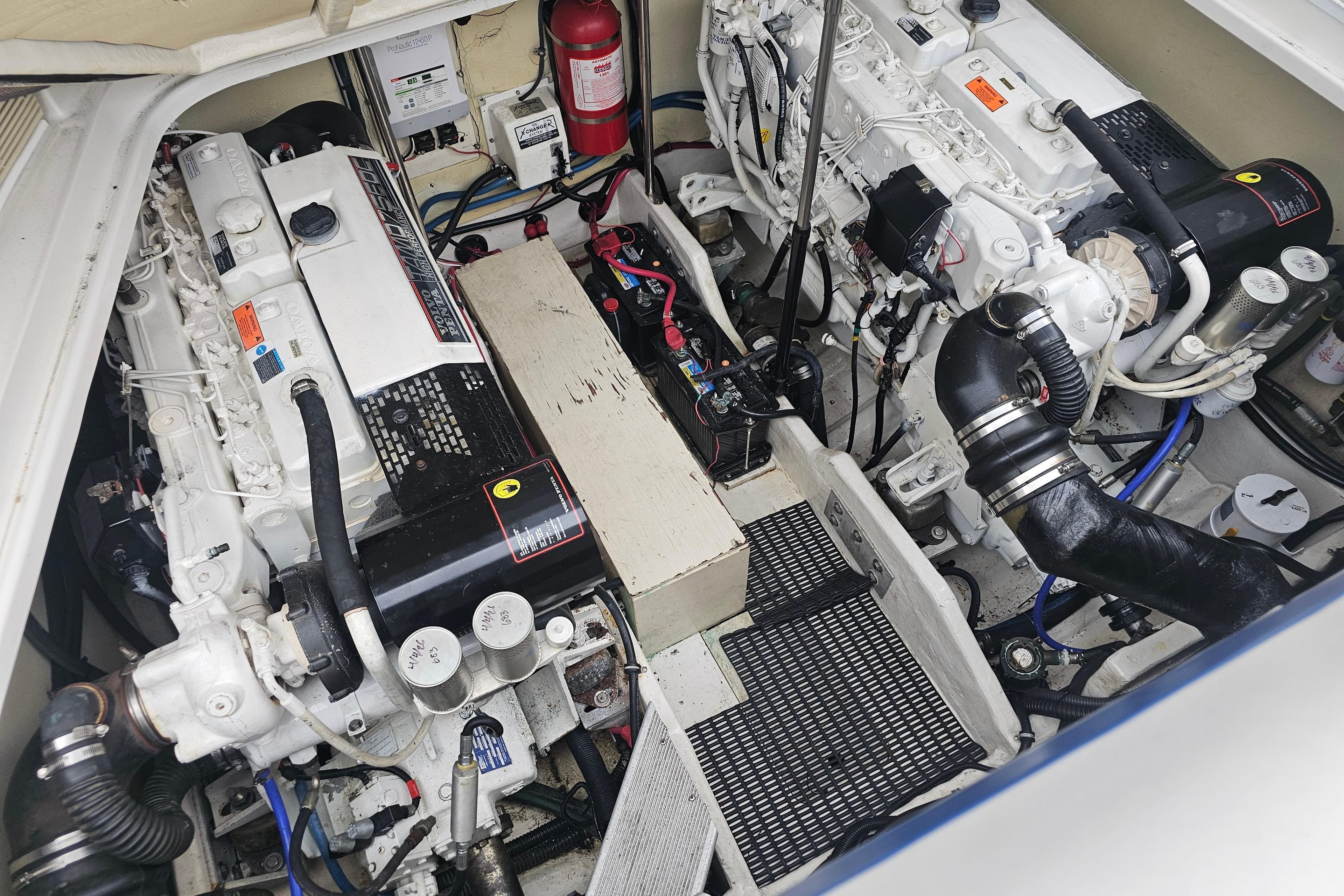 Engine compartment of a 2003 Formula 41 Performance Cruiser, showcasing dual engines and components.