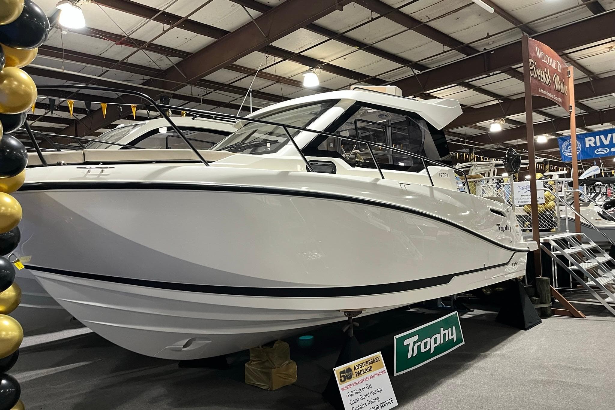 2026 Bayliner Trophy T23 Explorer boat displayed indoors at a marine exhibition.