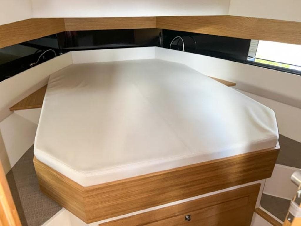 Interior cabin of 2023 De Antonio Yachts D42 Open with a spacious bed.