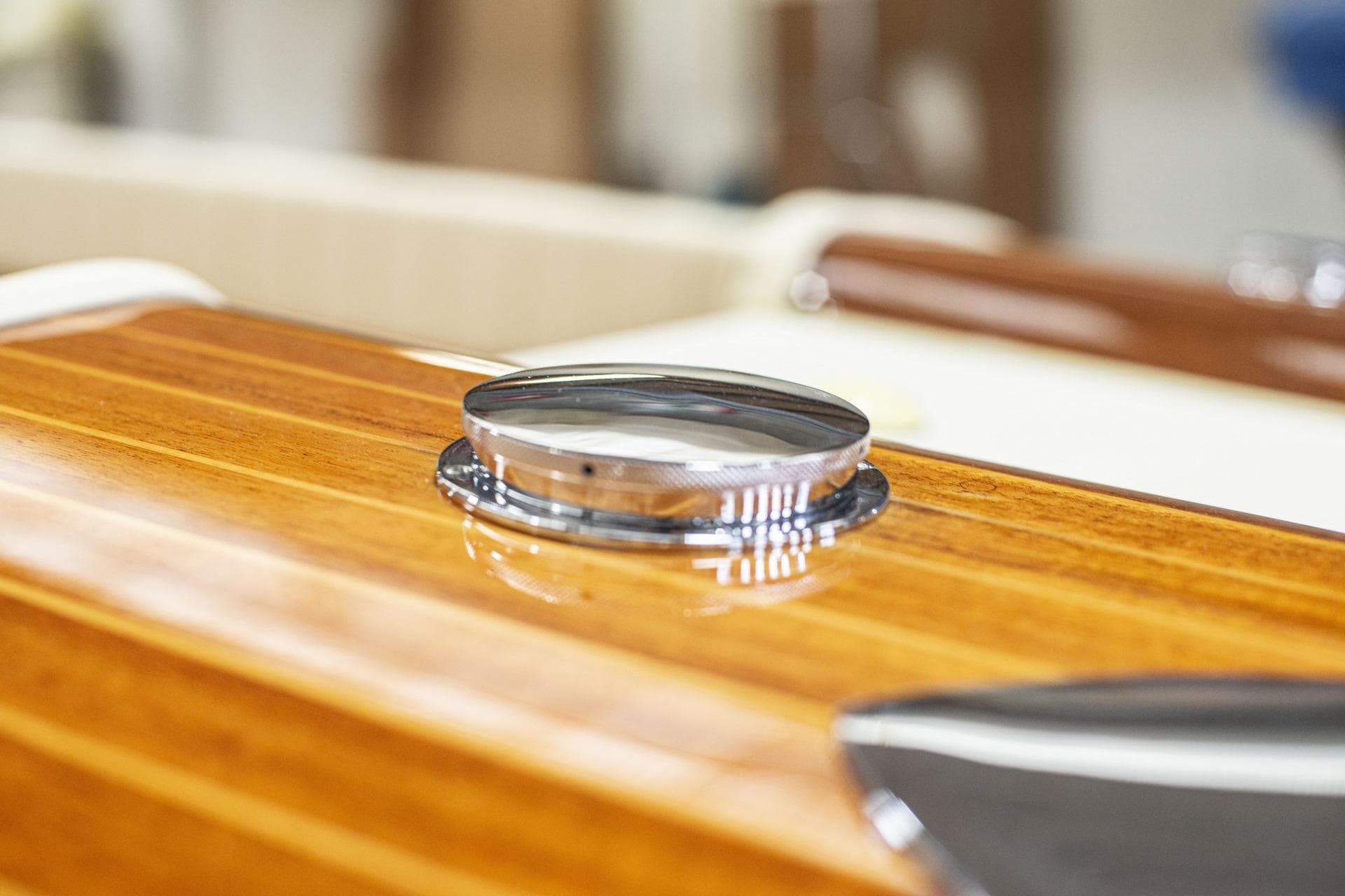 Close-up of a 1971 Riva Super Aquarama's polished wooden deck and chrome detail.