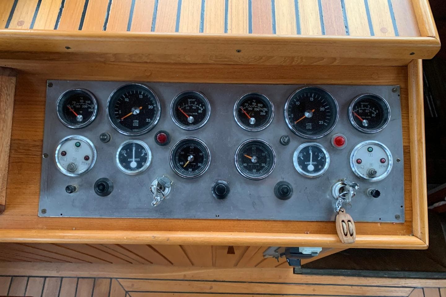 1979 Bueltjer Motorsailer control panel with gauges and switches on wooden dashboard.