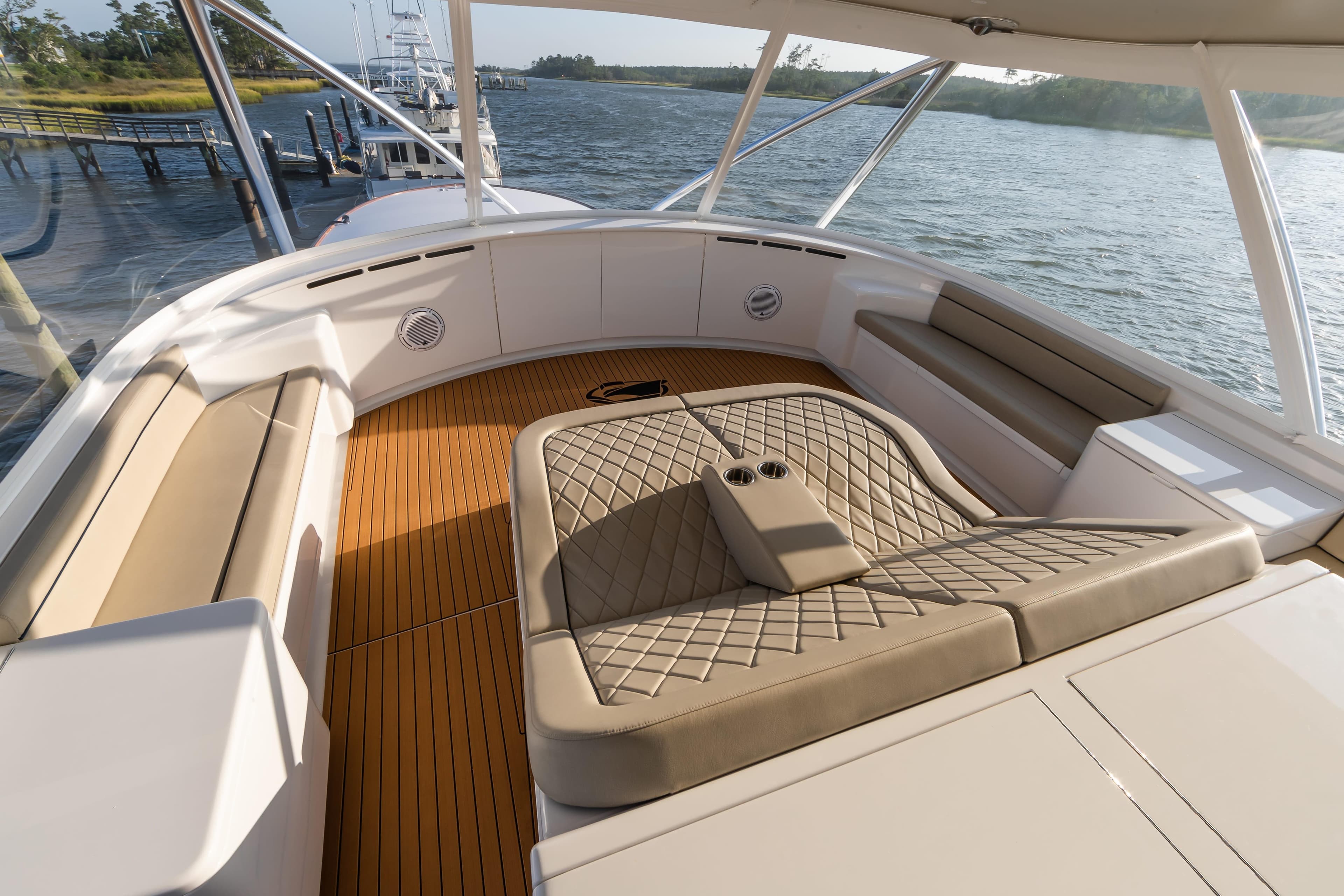 Luxurious seating area on a 2020 Jarrett Bay 84 yacht, featuring elegant design and waterfront views.