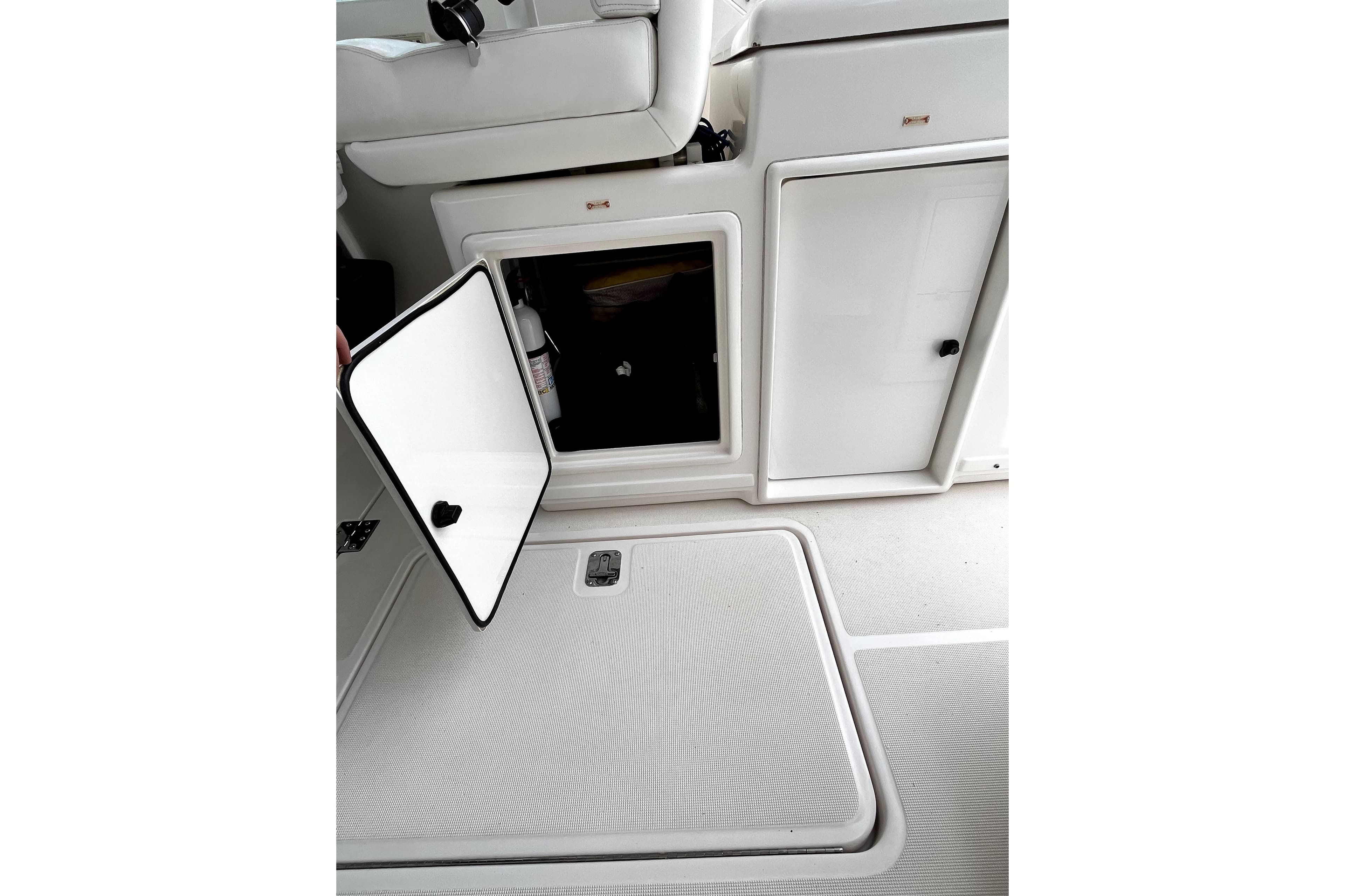 1999 Tiara Yachts 3500 Open interior storage compartment with open door, showcasing sleek design.