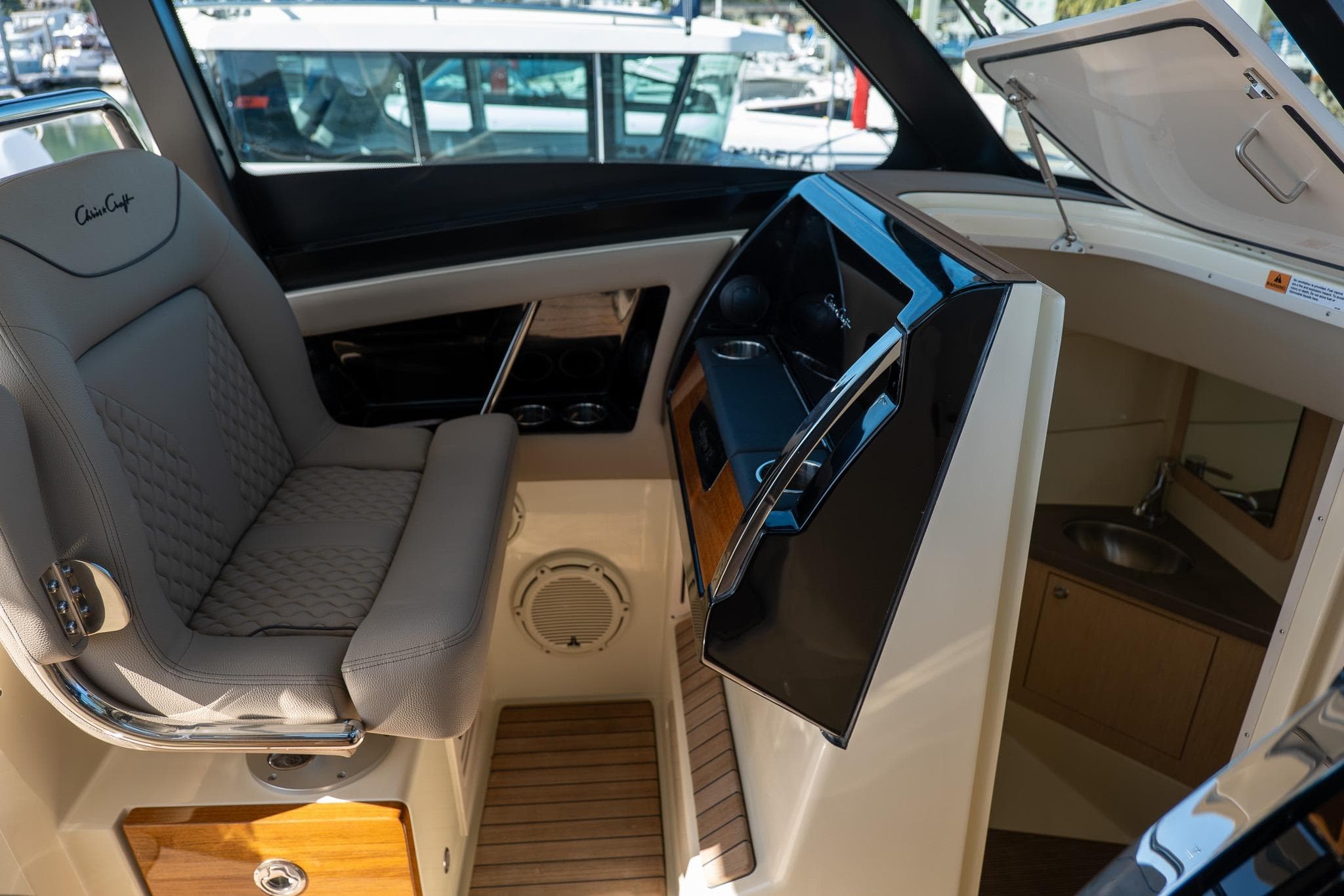 2024 Chris-Craft Calypso 32 interior with luxurious seating and modern amenities.