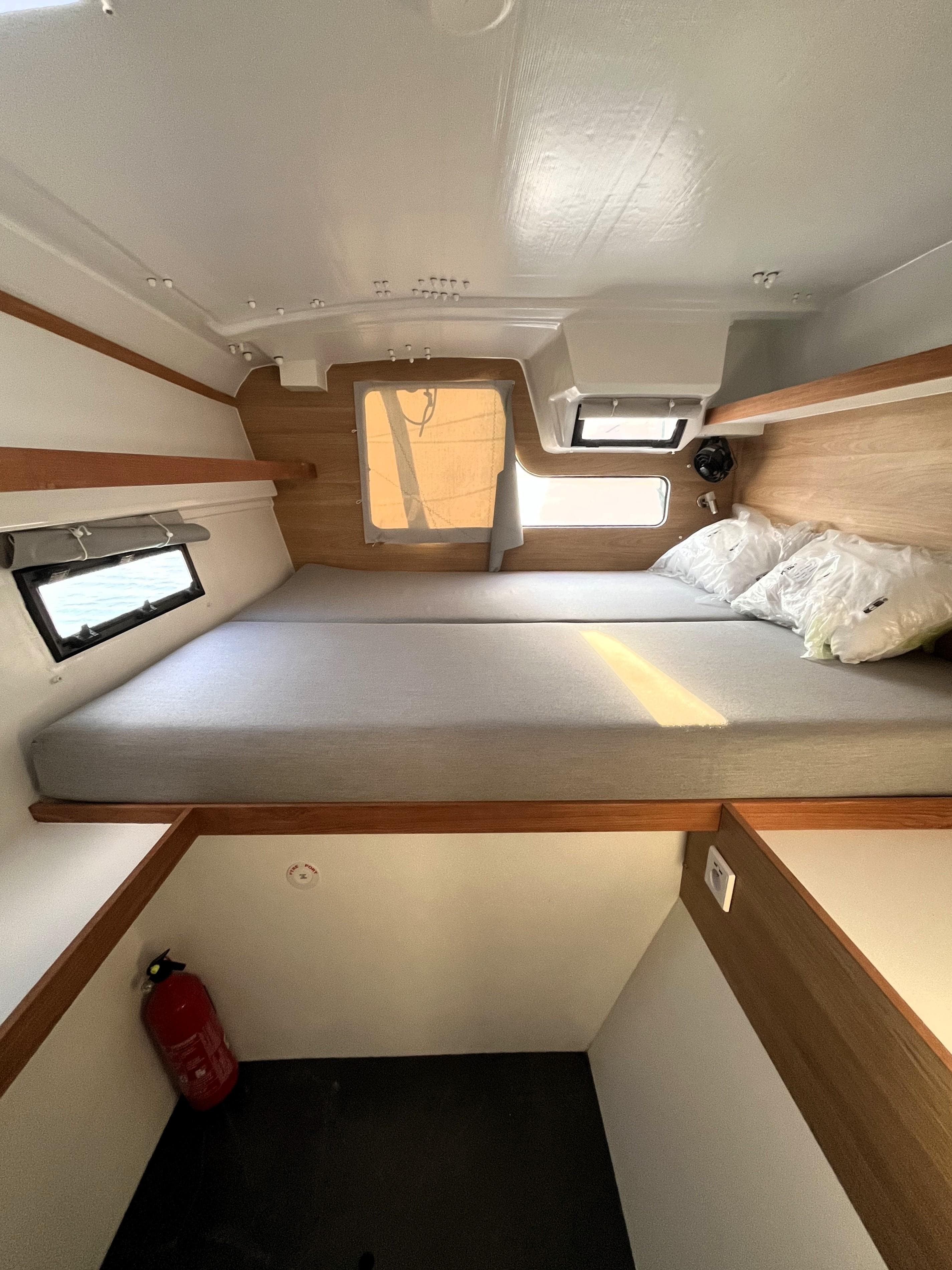 Cabin interior of 2021 Marsaudon Composites ORC 50 with bed and window.