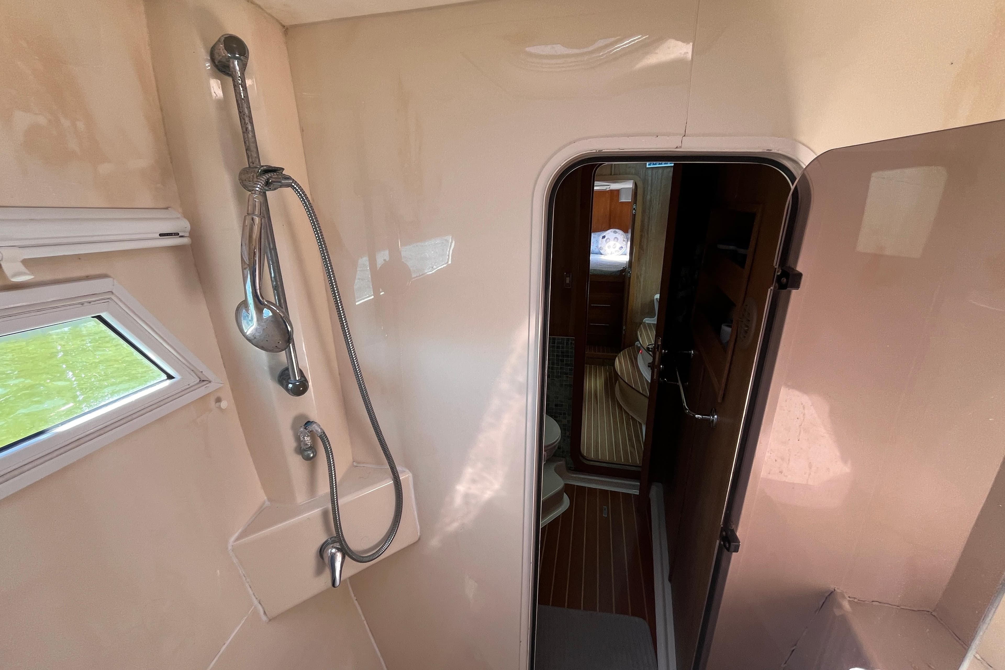 Interior of 2008 Broadblue 415 yacht featuring shower and cabin doorway.