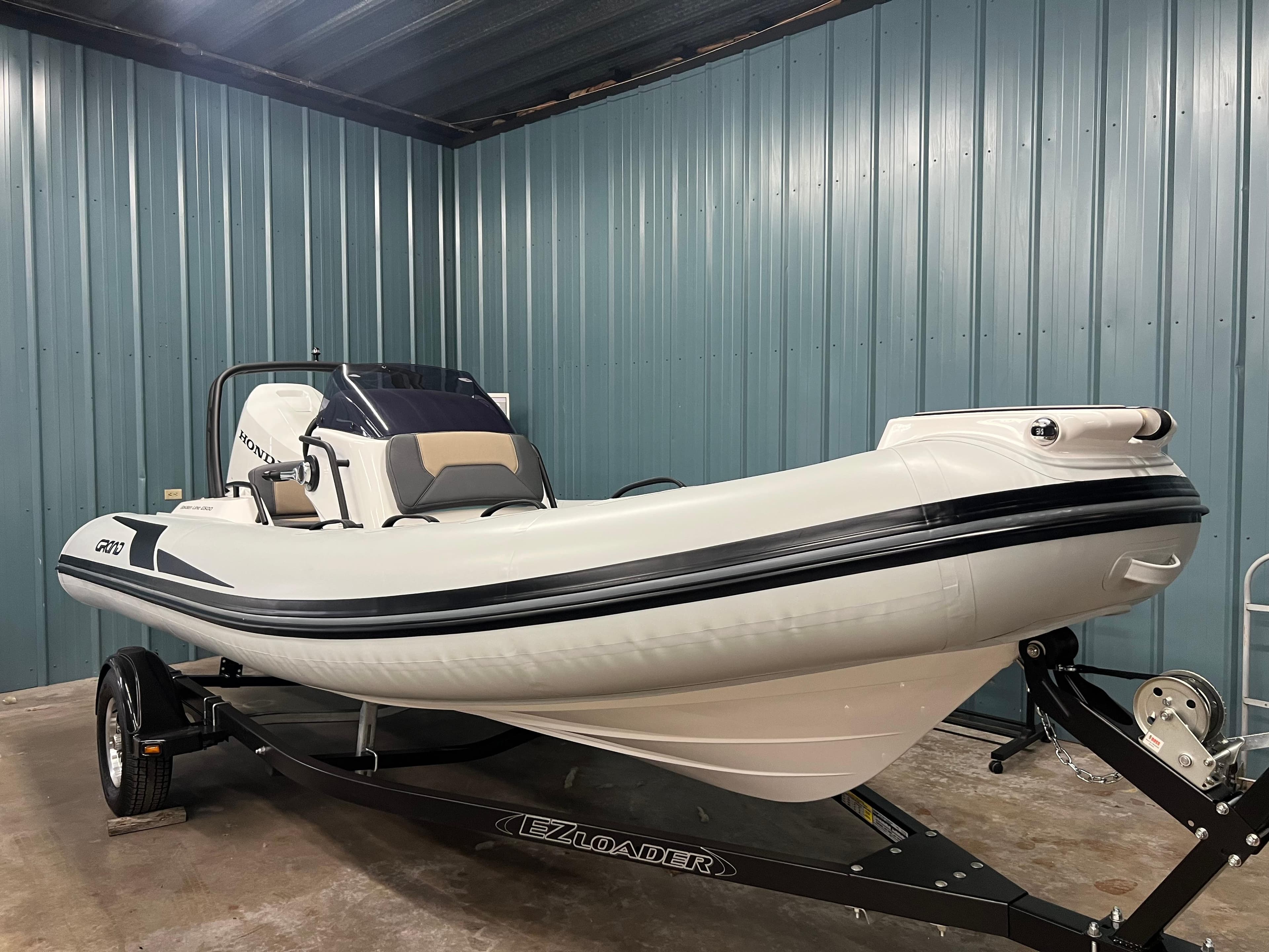 2025 Grand G500HLF inflatable boat on trailer in storage facility.