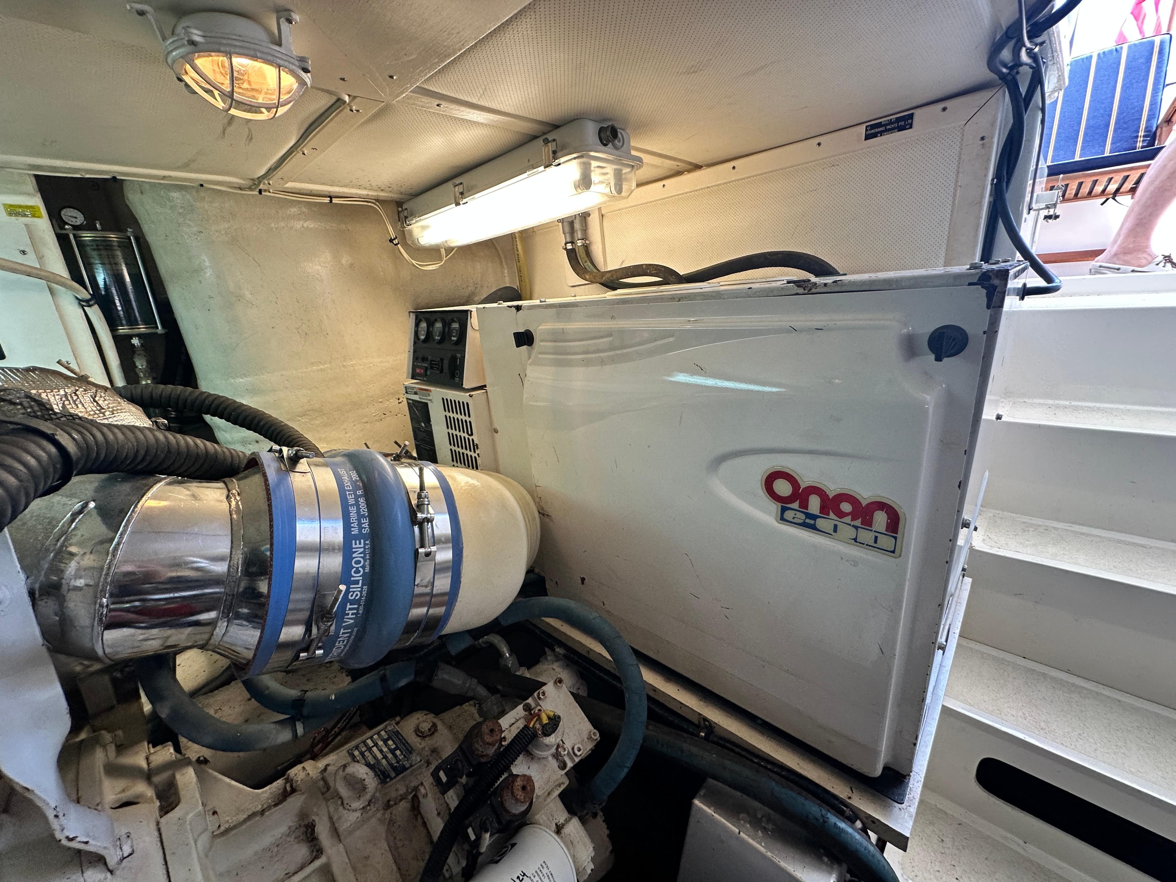 Engine room of 2004 Grand Banks 49 Eastbay HX with Onan generator.
