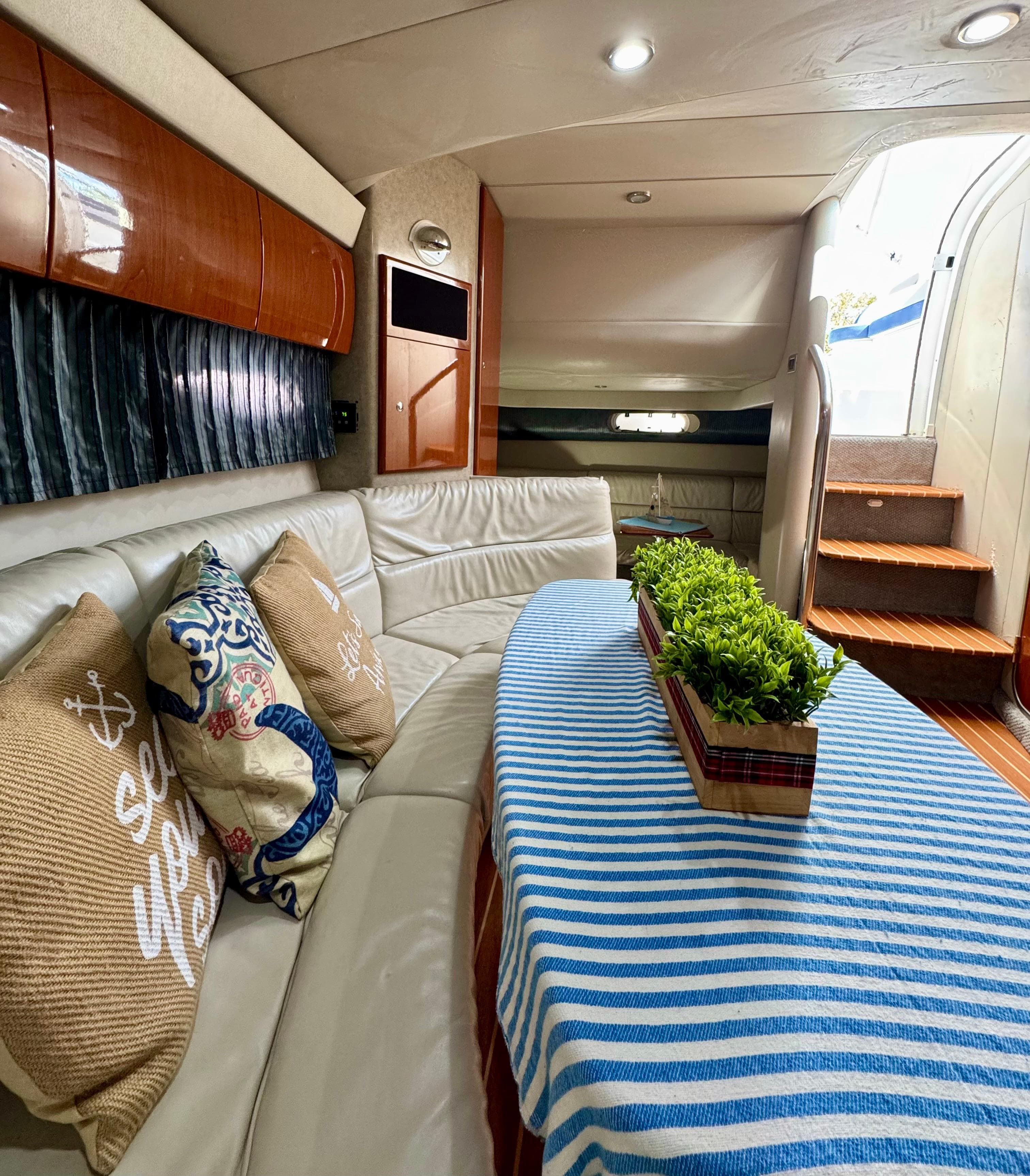 Interior of a 2006 Formula 40pc yacht with cozy seating and decorative pillows.
