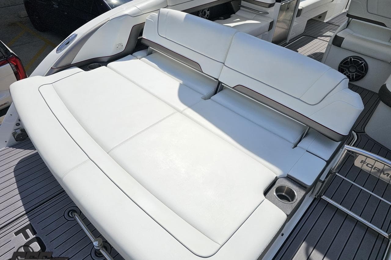 2020 Formula 330 Crossover Bowrider with spacious white seating and cup holders.
