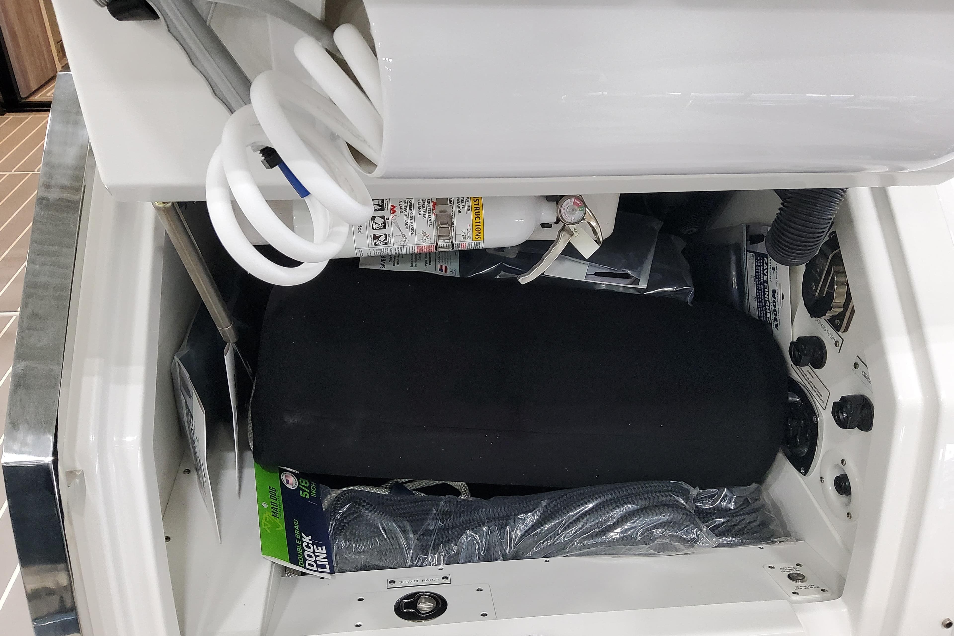 Interior compartment of 2026 Formula 500 Super Sport Crossover, featuring equipment and storage.