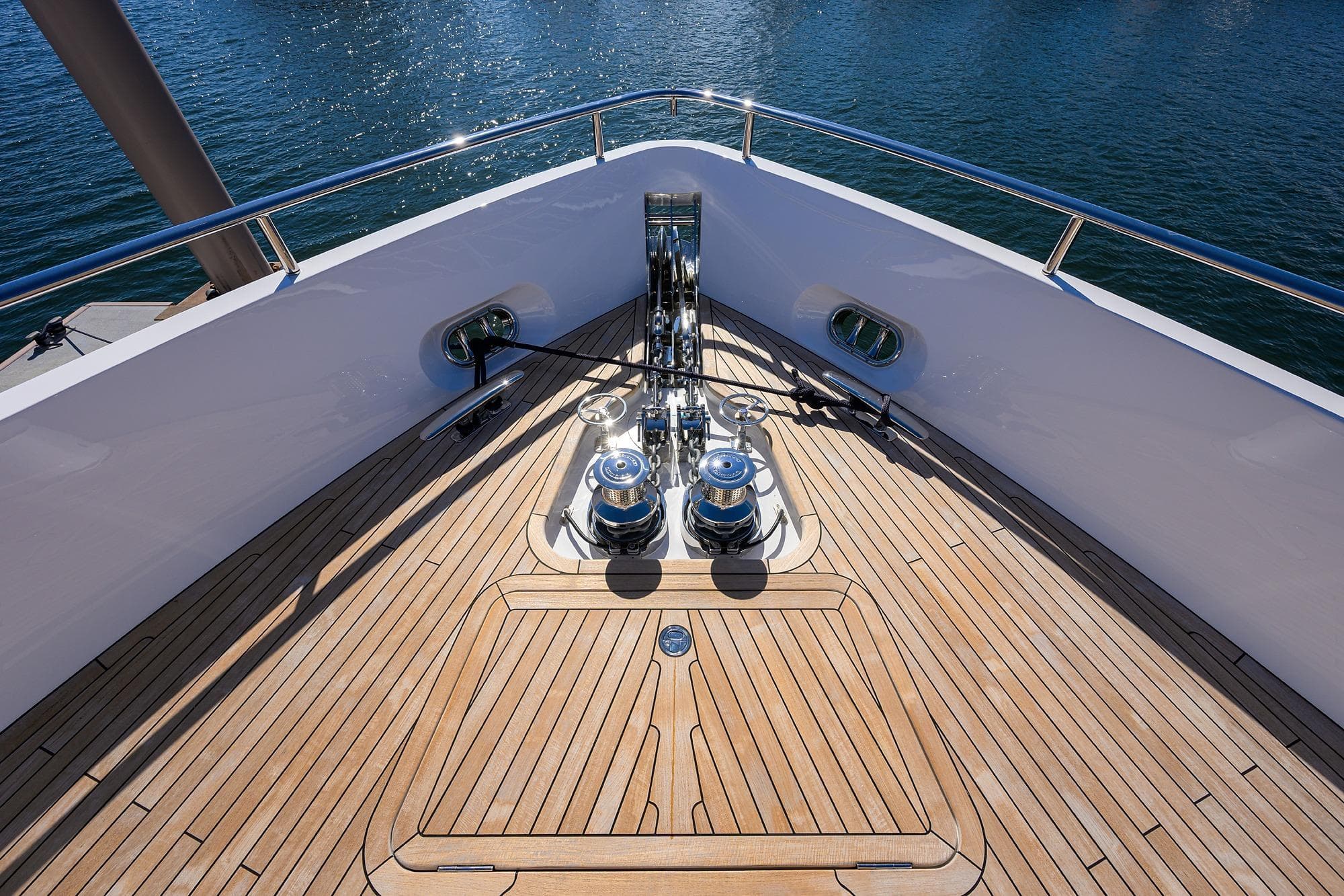 Deck of Princess X80 yacht, 2026 model, featuring wooden flooring.
