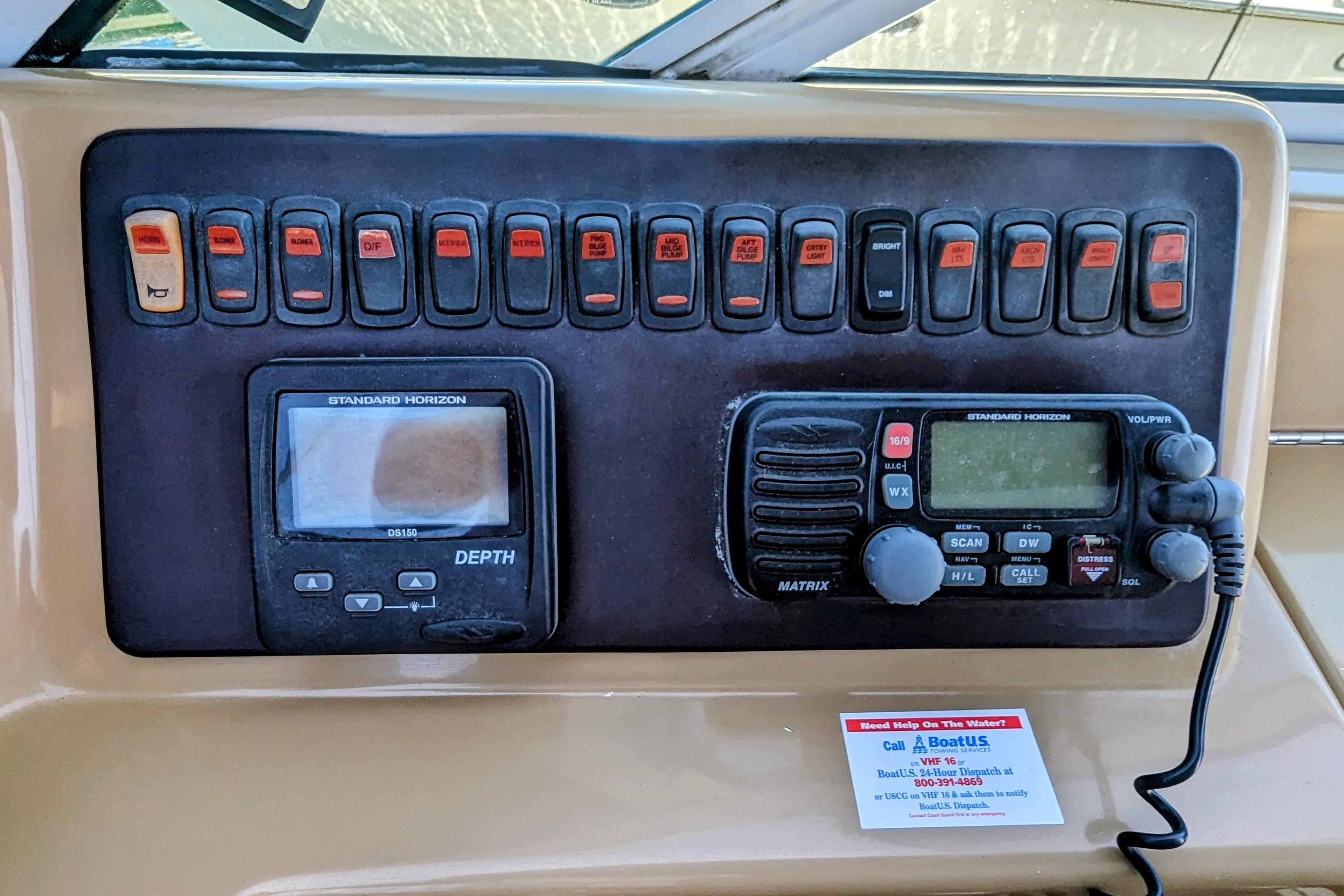Control panel of 2004 Carver 360 Mariner with depth gauge and radio equipment.