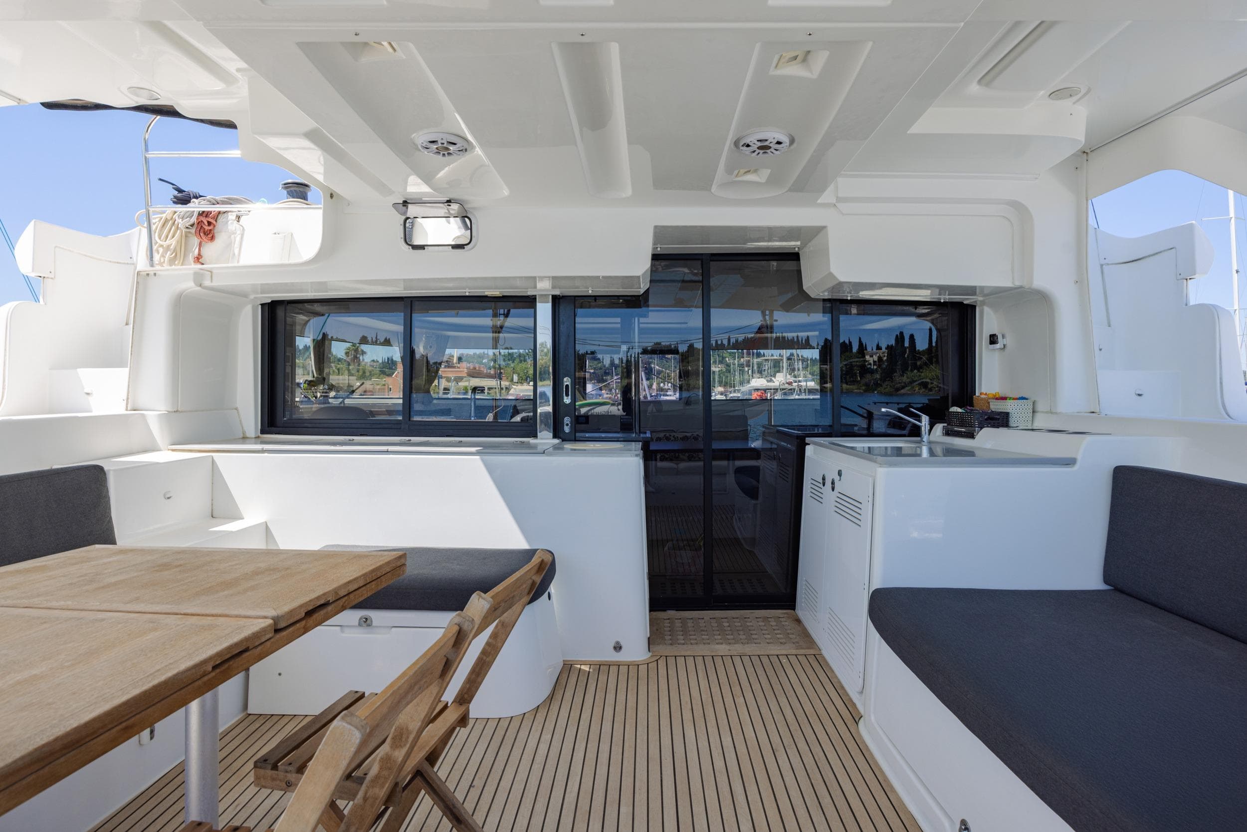 Spacious interior of 2020 Lagoon 46 catamaran with seating and dining area.