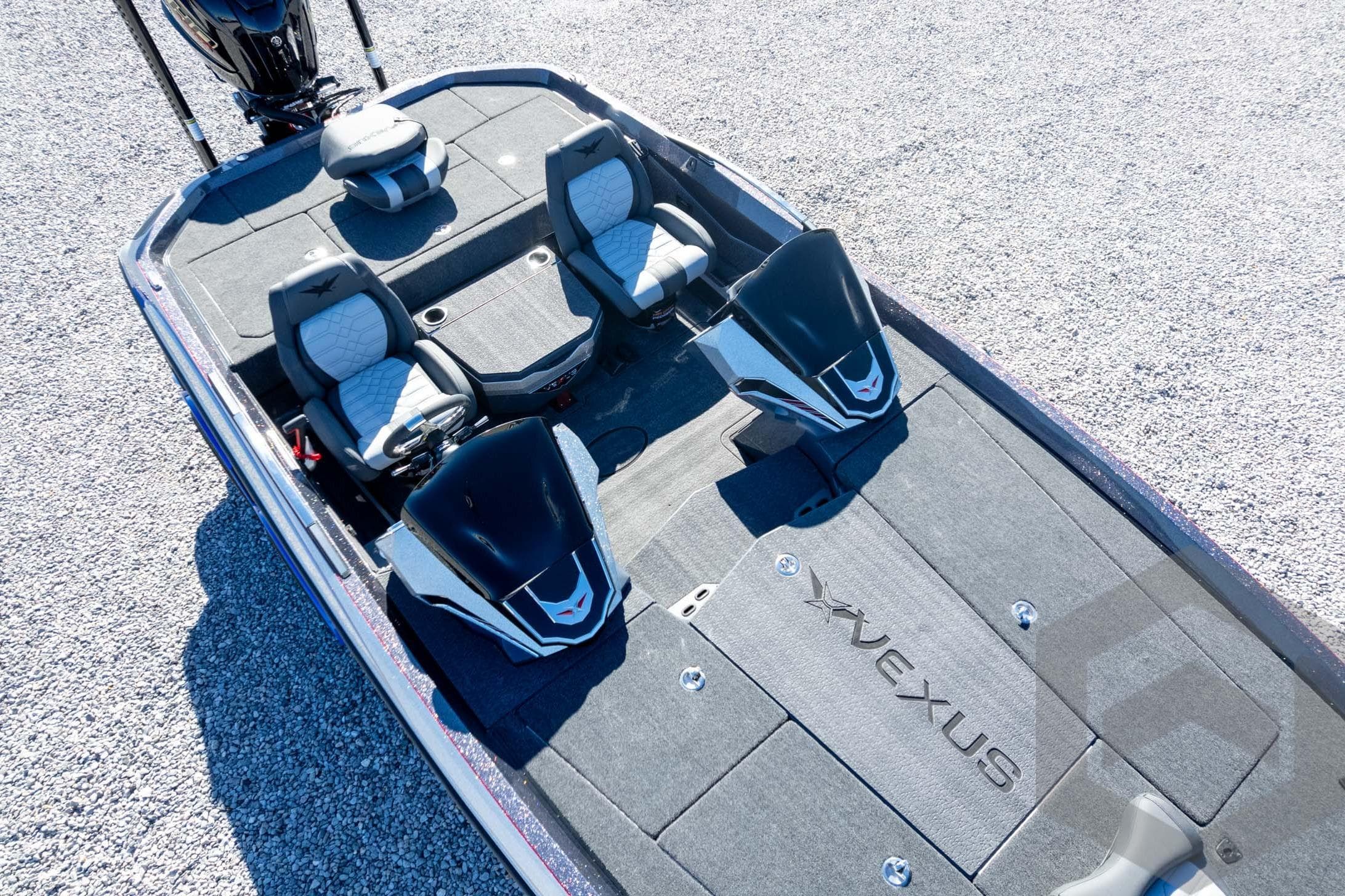 2026 Vexus VXs21 boat interior with dual seats and sleek design on gravel surface.