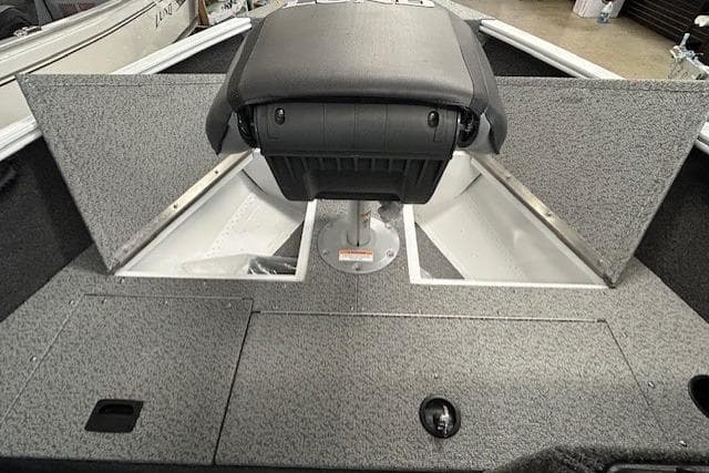 2026 Lund 1650 Rebel XL SS boat interior with storage compartments and seating.