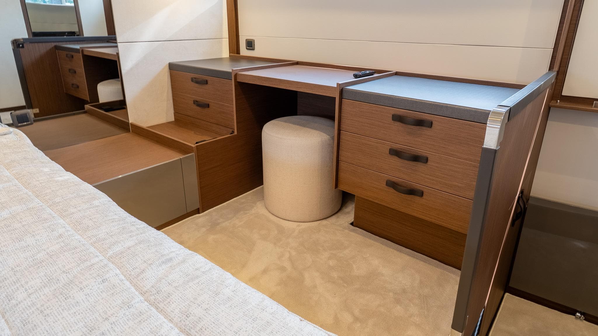 Luxurious interior of 2026 Prestige M48 yacht with wooden cabinetry and seating.