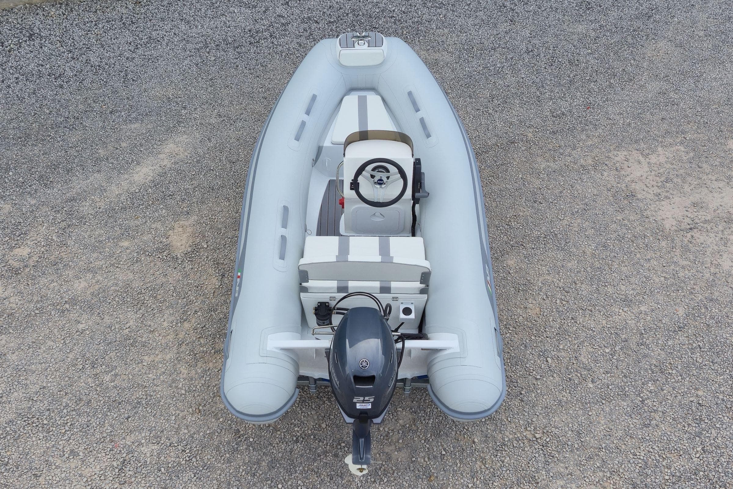 2024 AB Inflatables 10 ALX boat, top view on gravel surface.
