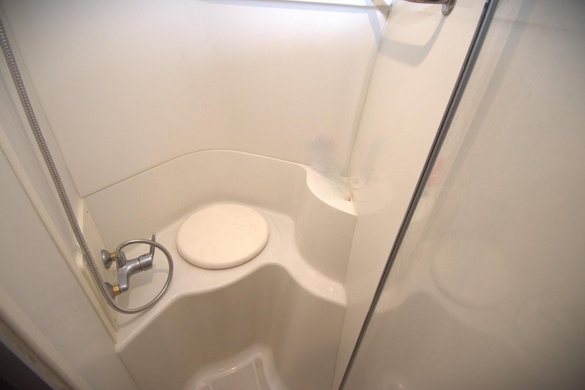 Shower area in 2005 Carver 444 Cockpit Motor Yacht, featuring a compact design.
