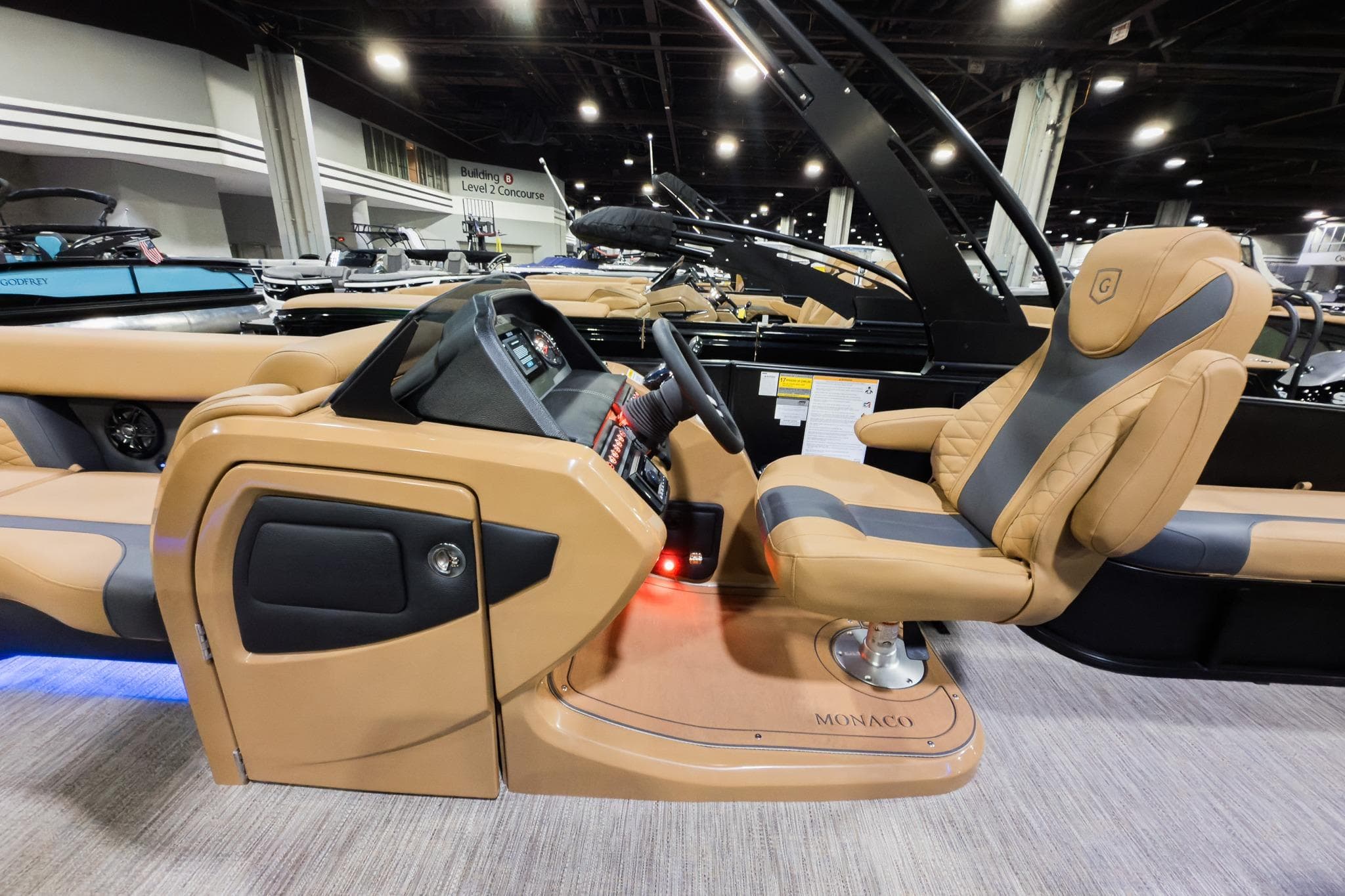 Luxurious 2026 Godfrey Monaco 255 boat interior with premium seating and modern dashboard.