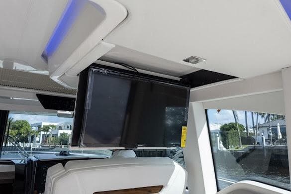 2022 Tiara Sport 43 LE interior with mounted TV and modern seating.