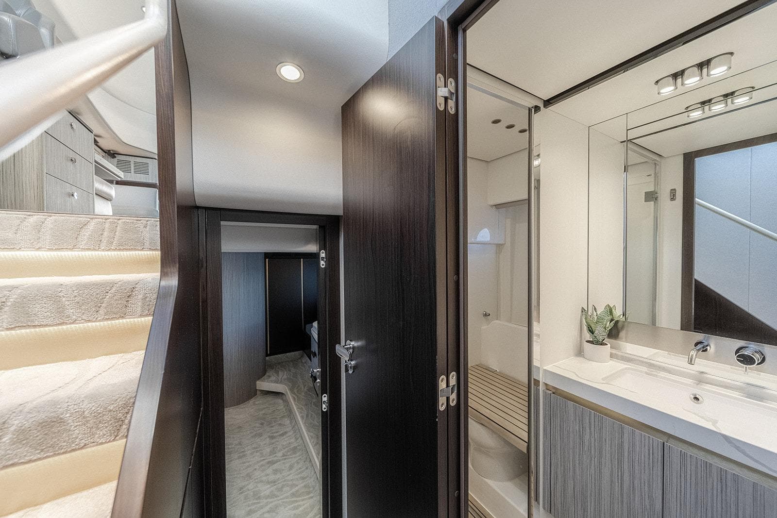 Interior of 2020 Azimut 60 yacht featuring stairs, bathroom, and modern design elements.