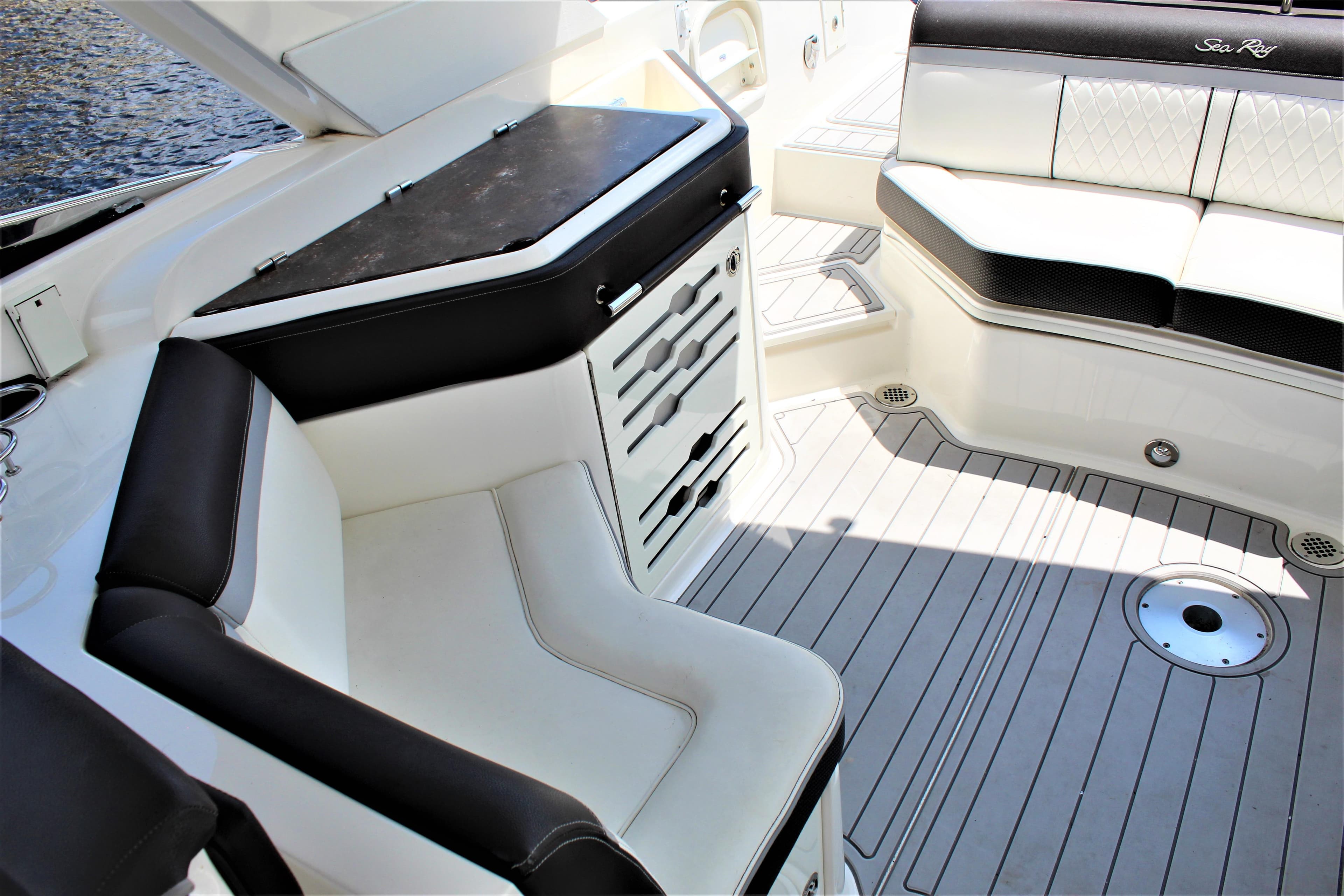 Interior of a 2017 Sea Ray SLX 310 with luxurious seating arrangement.