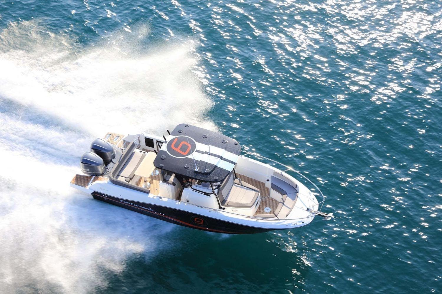 2026 Jeanneau Cap Camarat 9.0 CC cruising on open water, top view.
