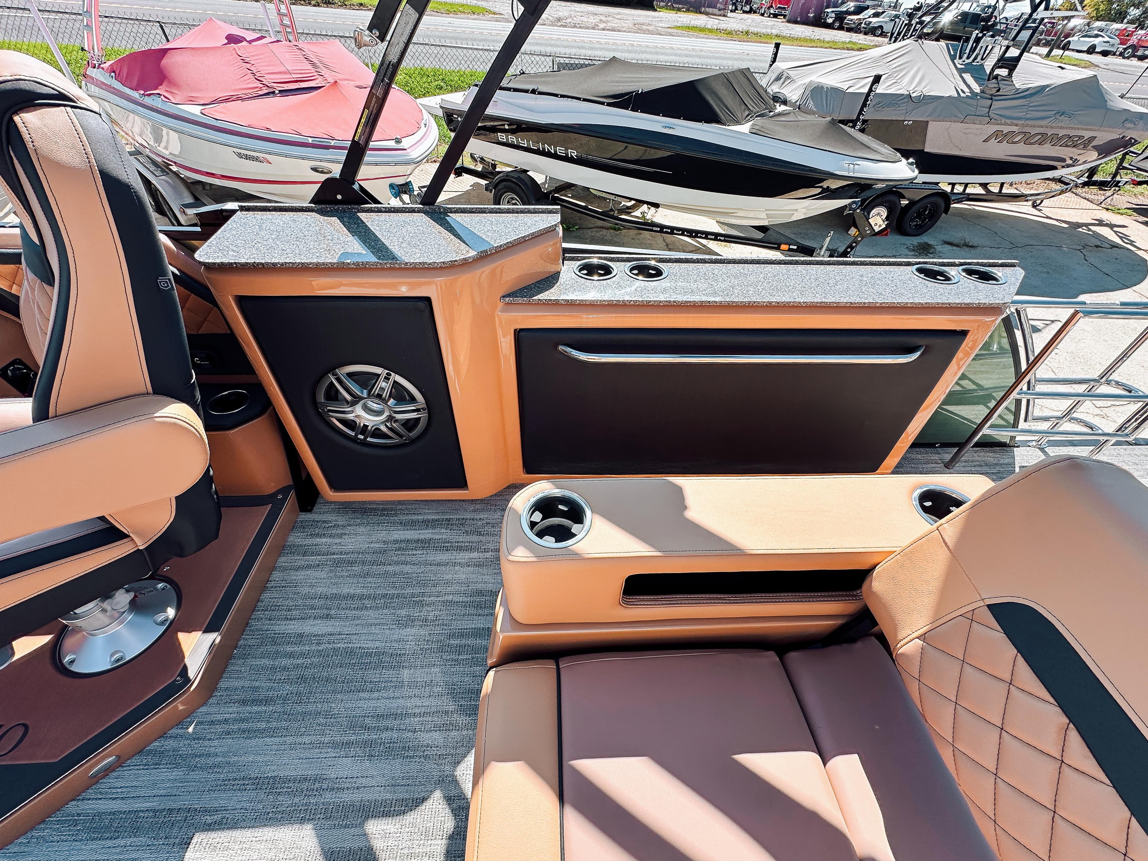 2025 Godfrey AquaPatio 23' Flip Lounge Tritoon interior with luxurious seating and modern design.