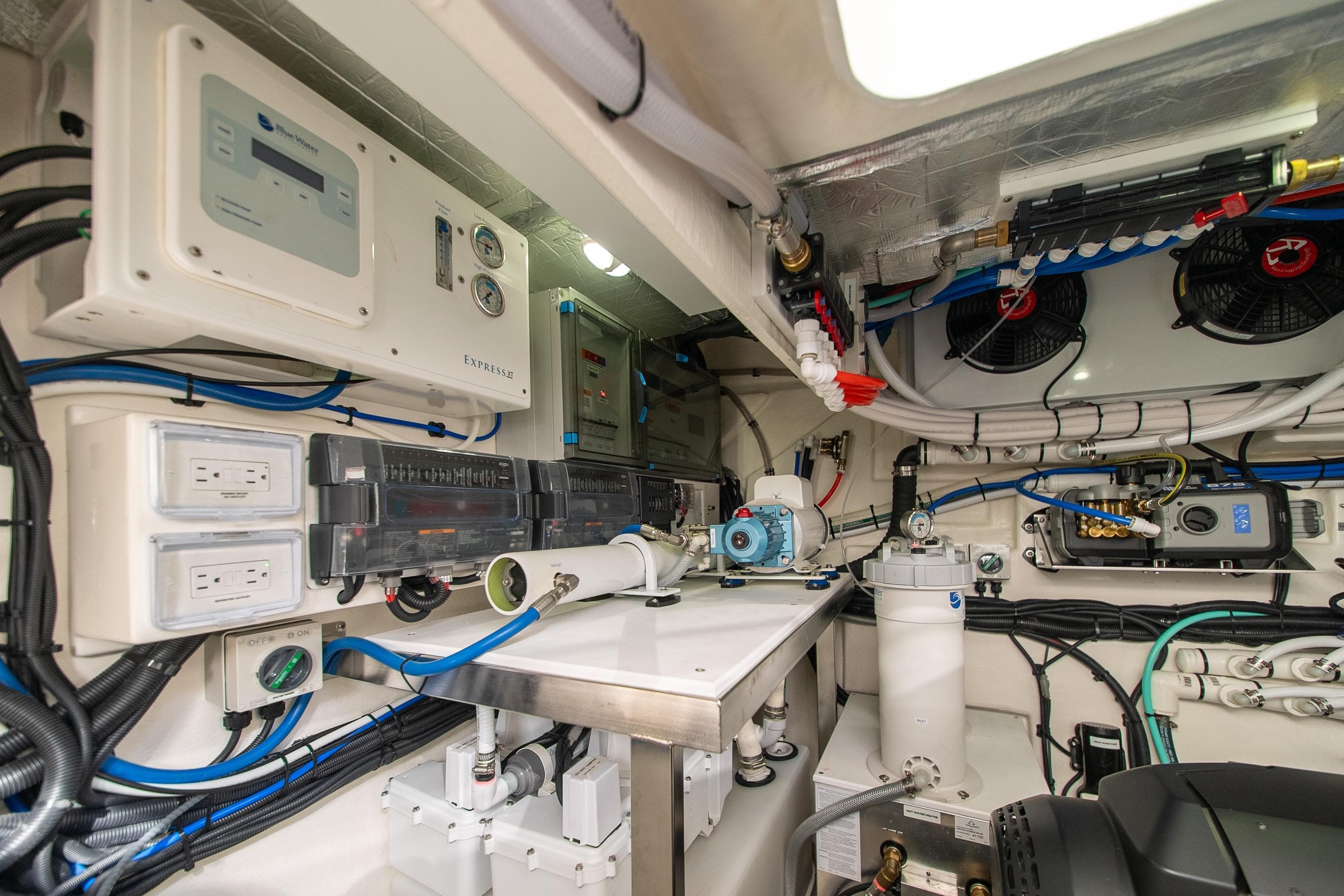 Engine room of 2026 Riviera 4600 Sport Yacht Platinum Edition, showcasing advanced electrical systems.