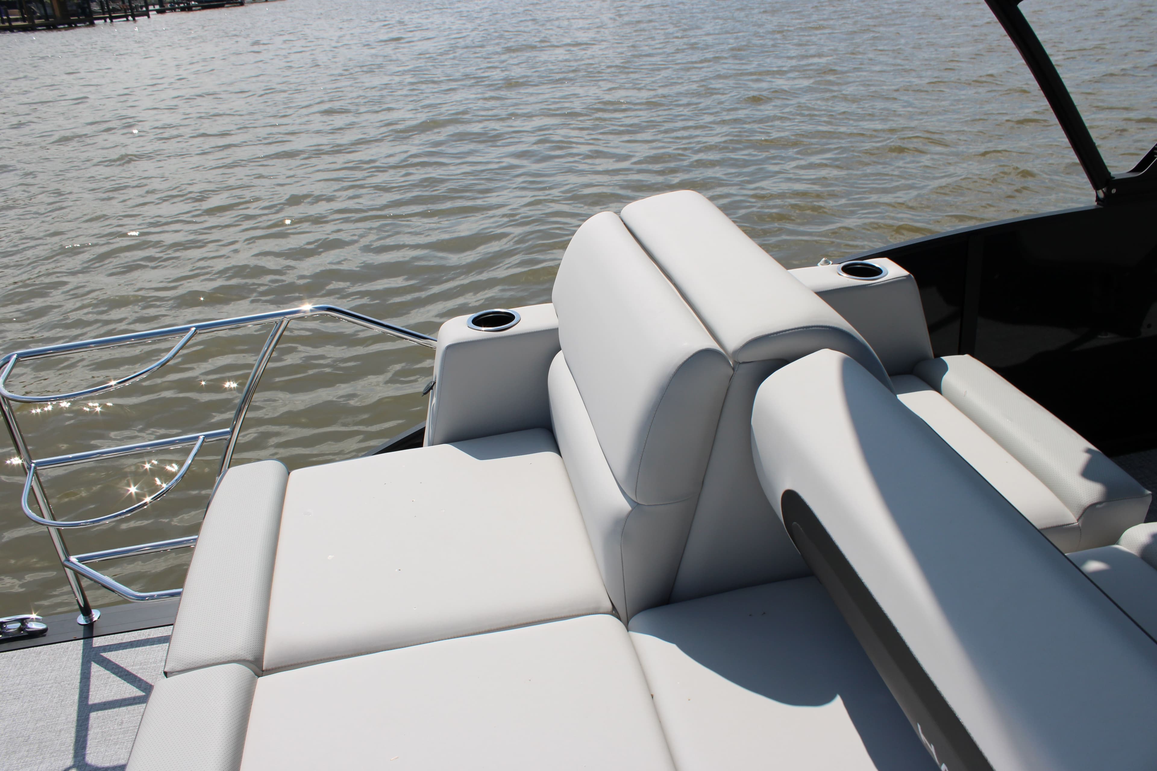 Harris Cruiser 230 2026 with luxurious white seating on the water.
