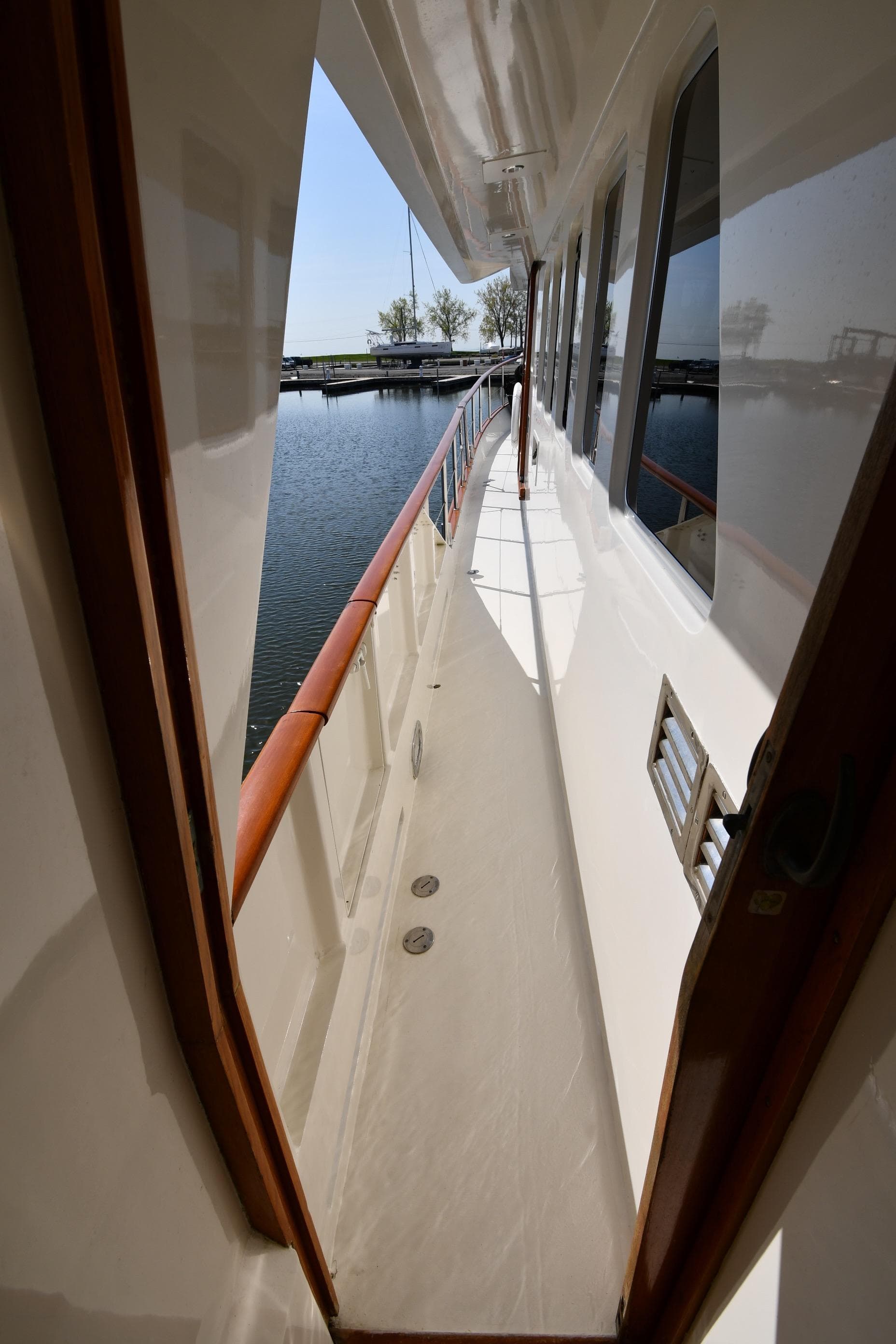 Side deck view of 1986 Lowland 64 Pilot House Long Range Motor Yacht.