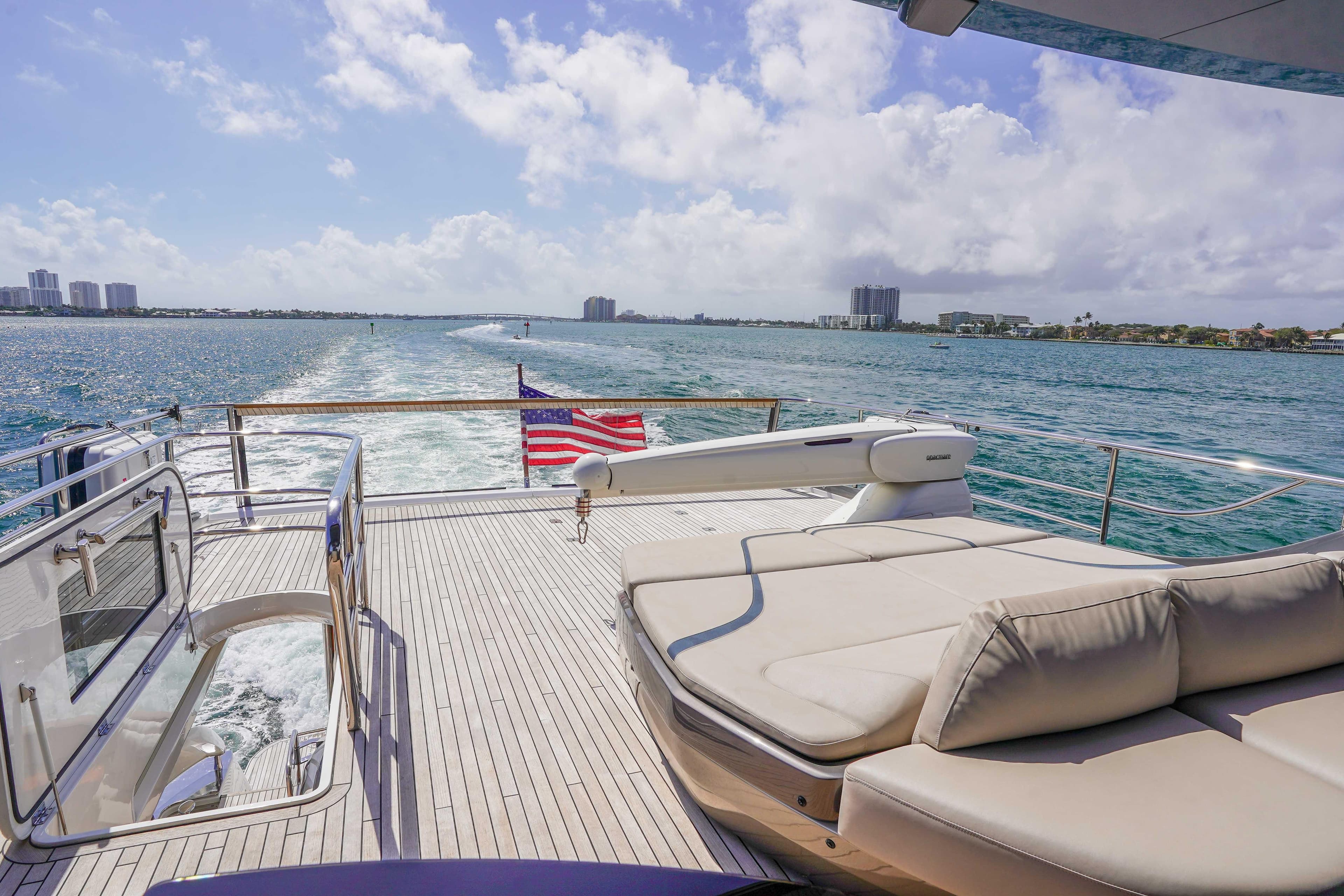 Luxurious 2021 Princess Y85 yacht deck with ocean view and American flag.