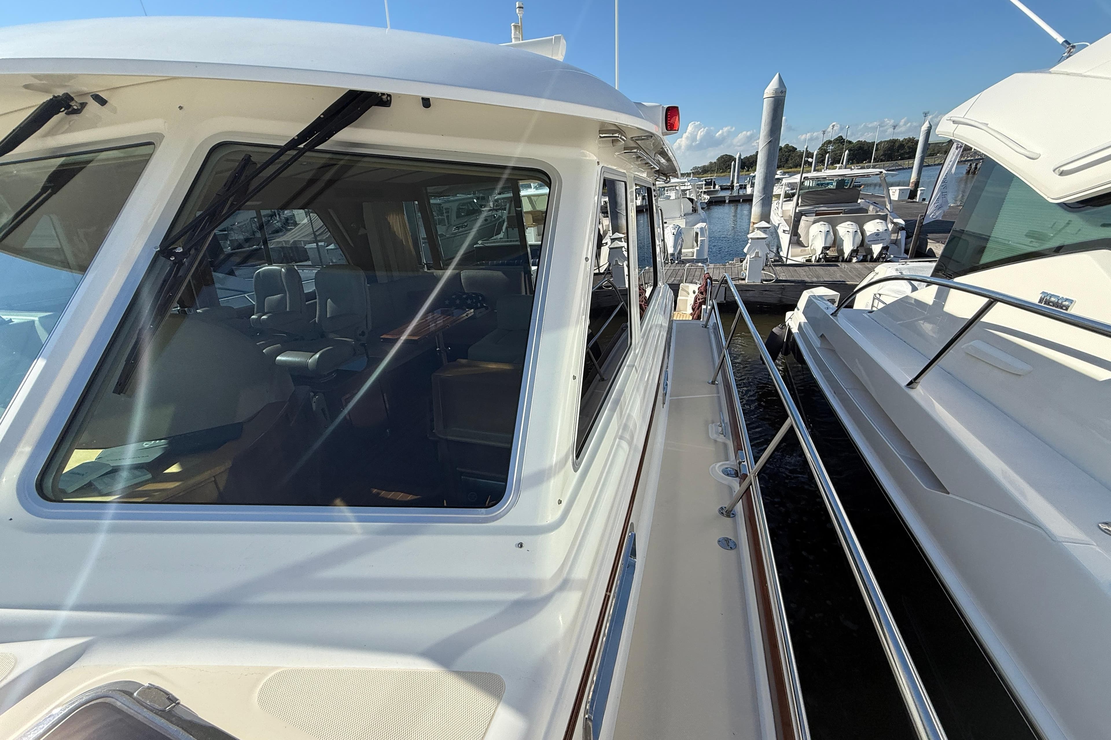 2017 Sabre 48 Salon Express yacht docked at marina, showcasing sleek design and spacious interior.
