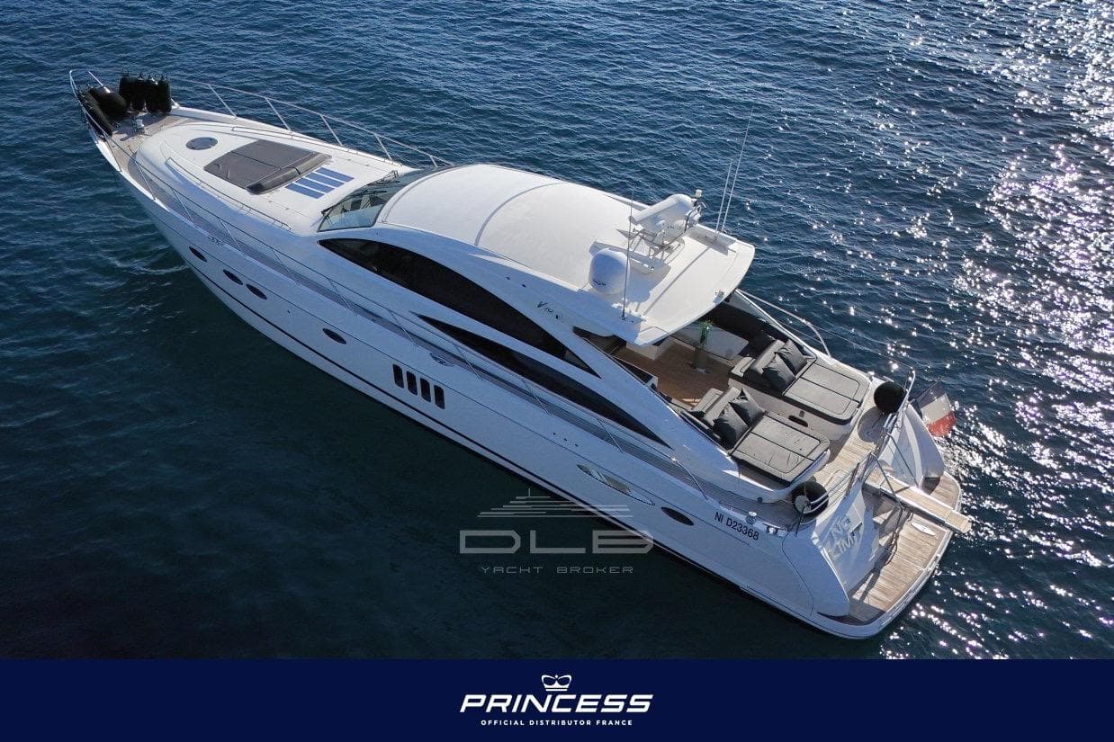 Luxury 2006 Princess V70 yacht cruising on open water, aerial view.