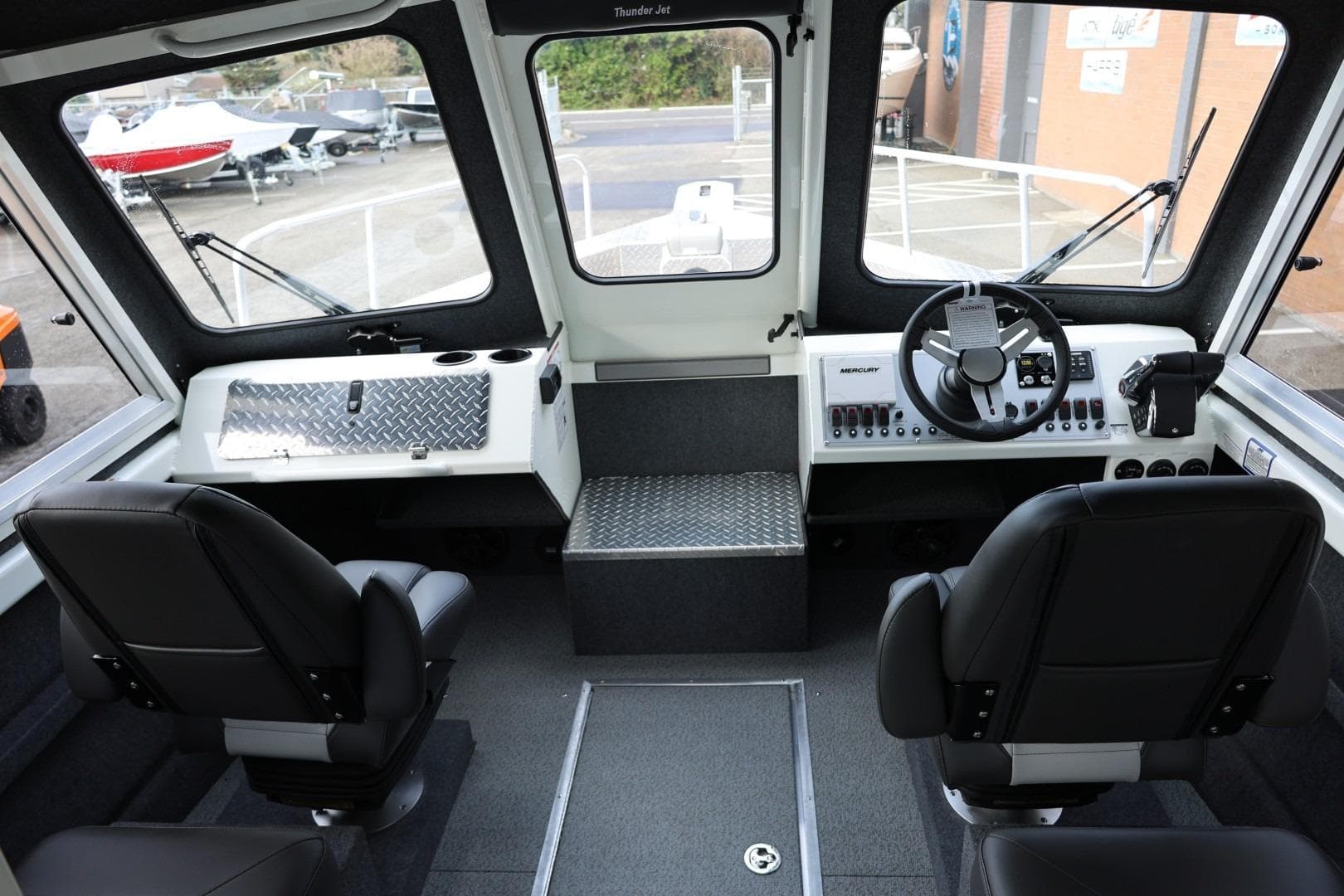 Interior of 2026 Thunder Jet 26 Alexis Pro XL boat, featuring modern controls and seating.