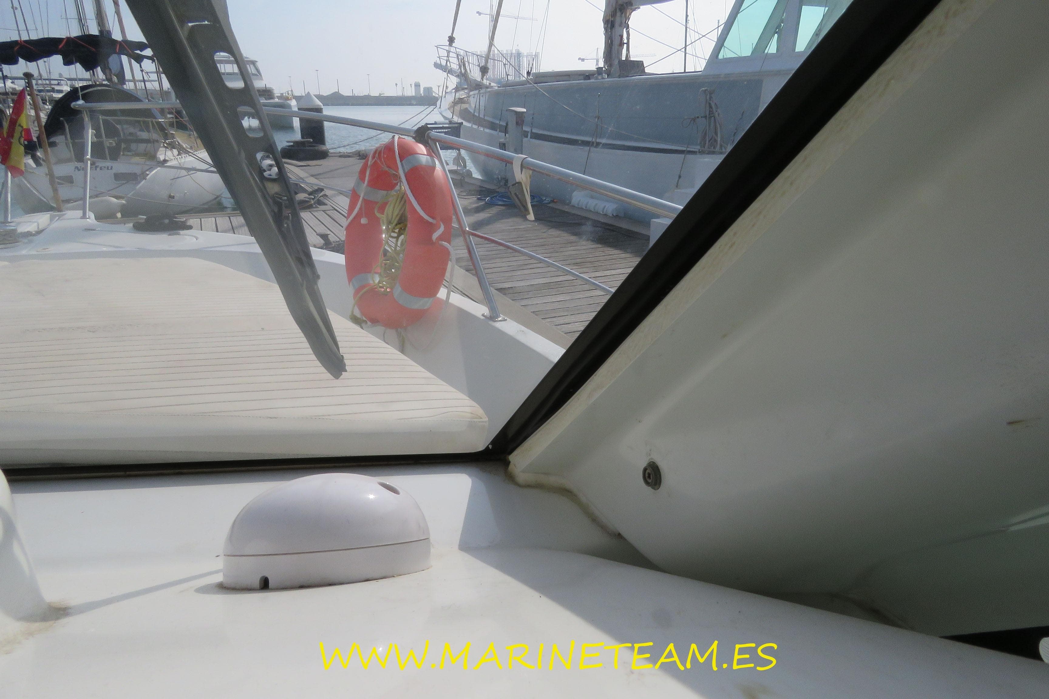Starfisher 1060 boat interior view with docked yachts, 2005 model.