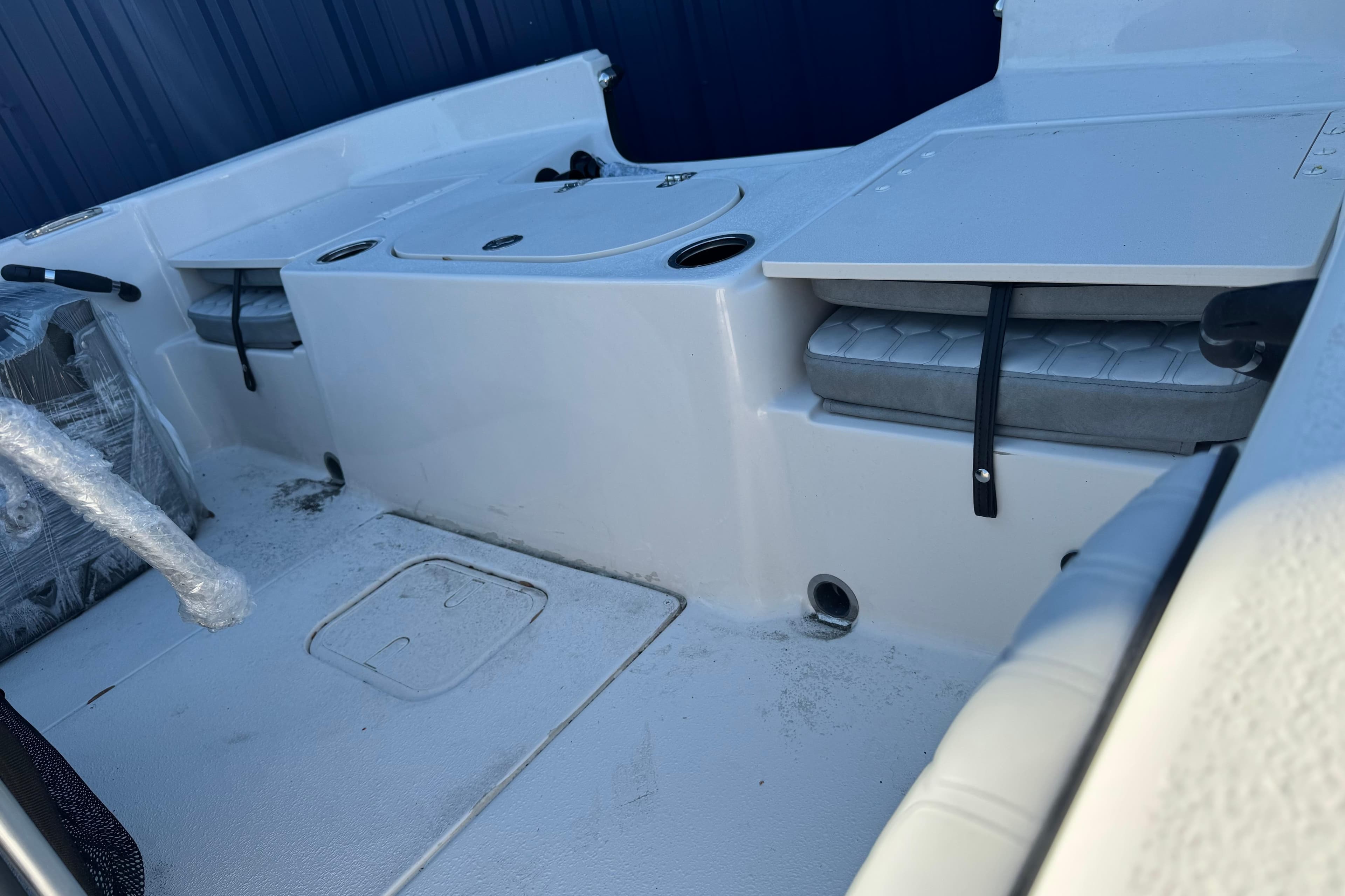 2026 Carolina Skiff 19 LS boat interior with seating and storage compartments.