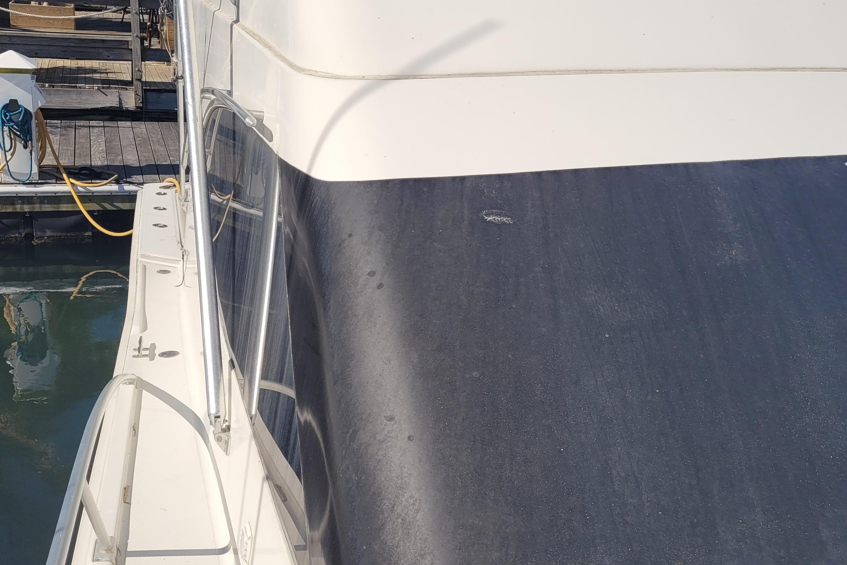 2001 Luhrs 34 Convertible yacht deck view at marina.