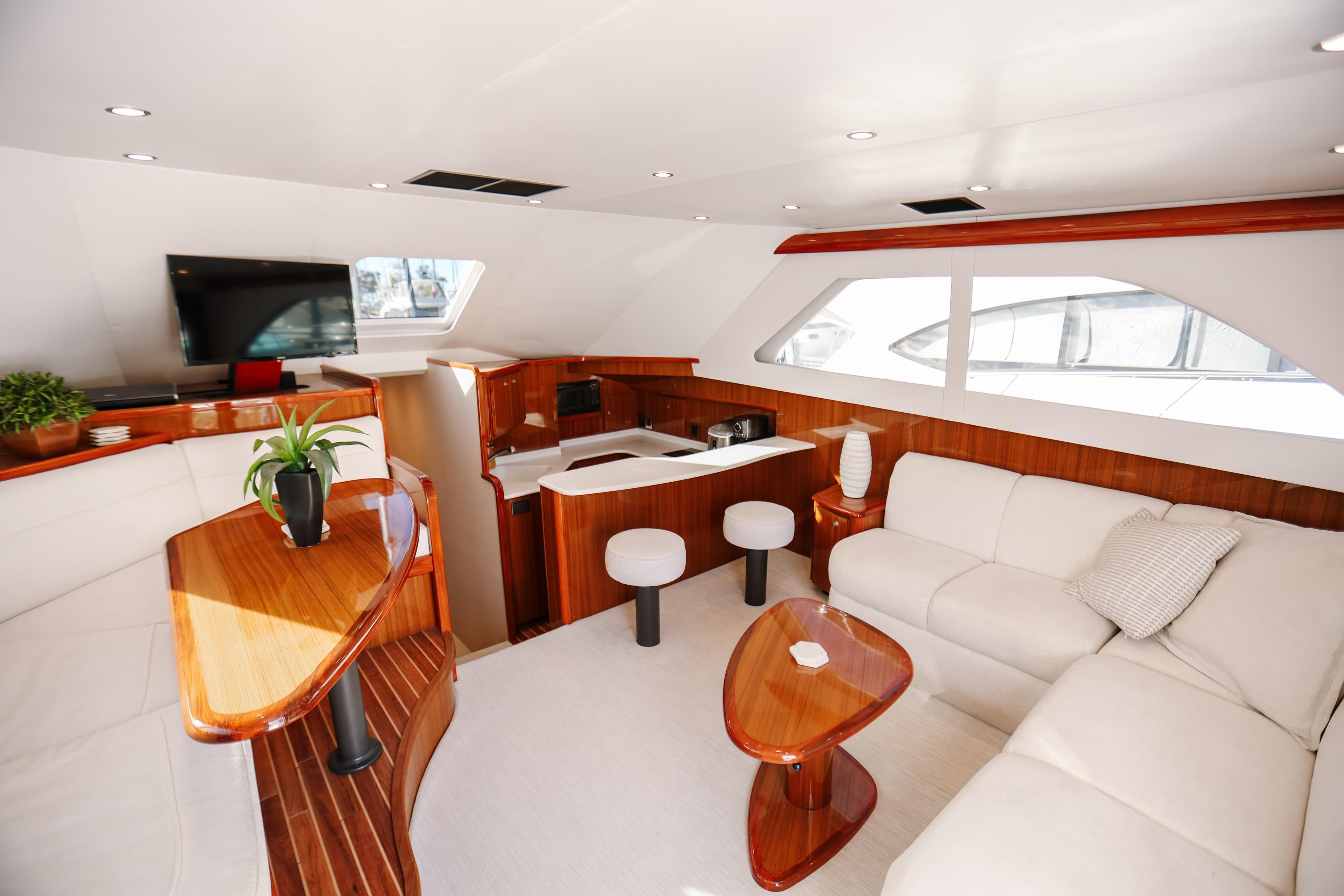 Luxurious interior of 2013 Viking 42 Convertible yacht with modern furnishings and elegant design.