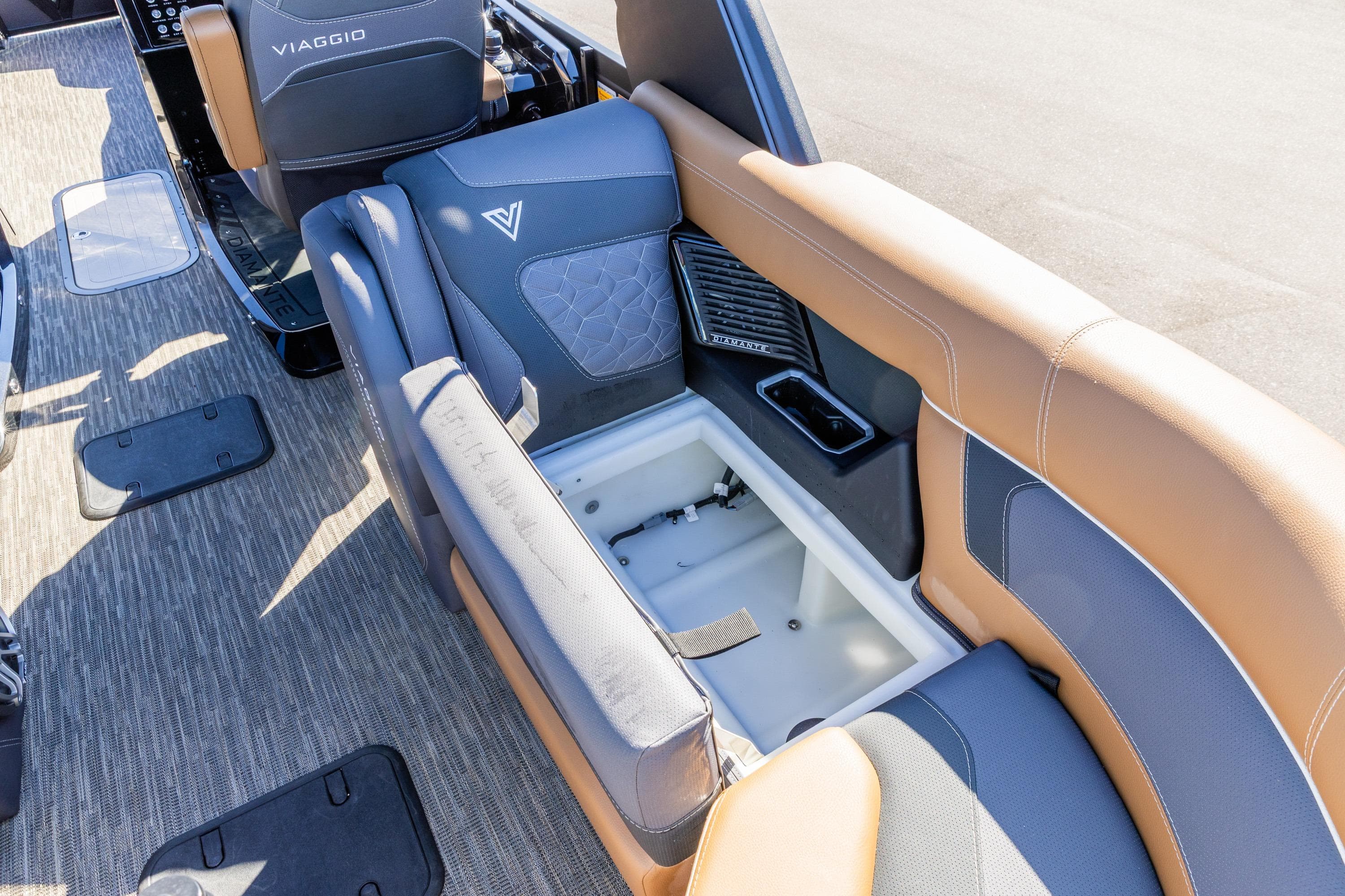 2026 Viaggio Diamante UWA boat interior with storage compartment and luxurious seating.