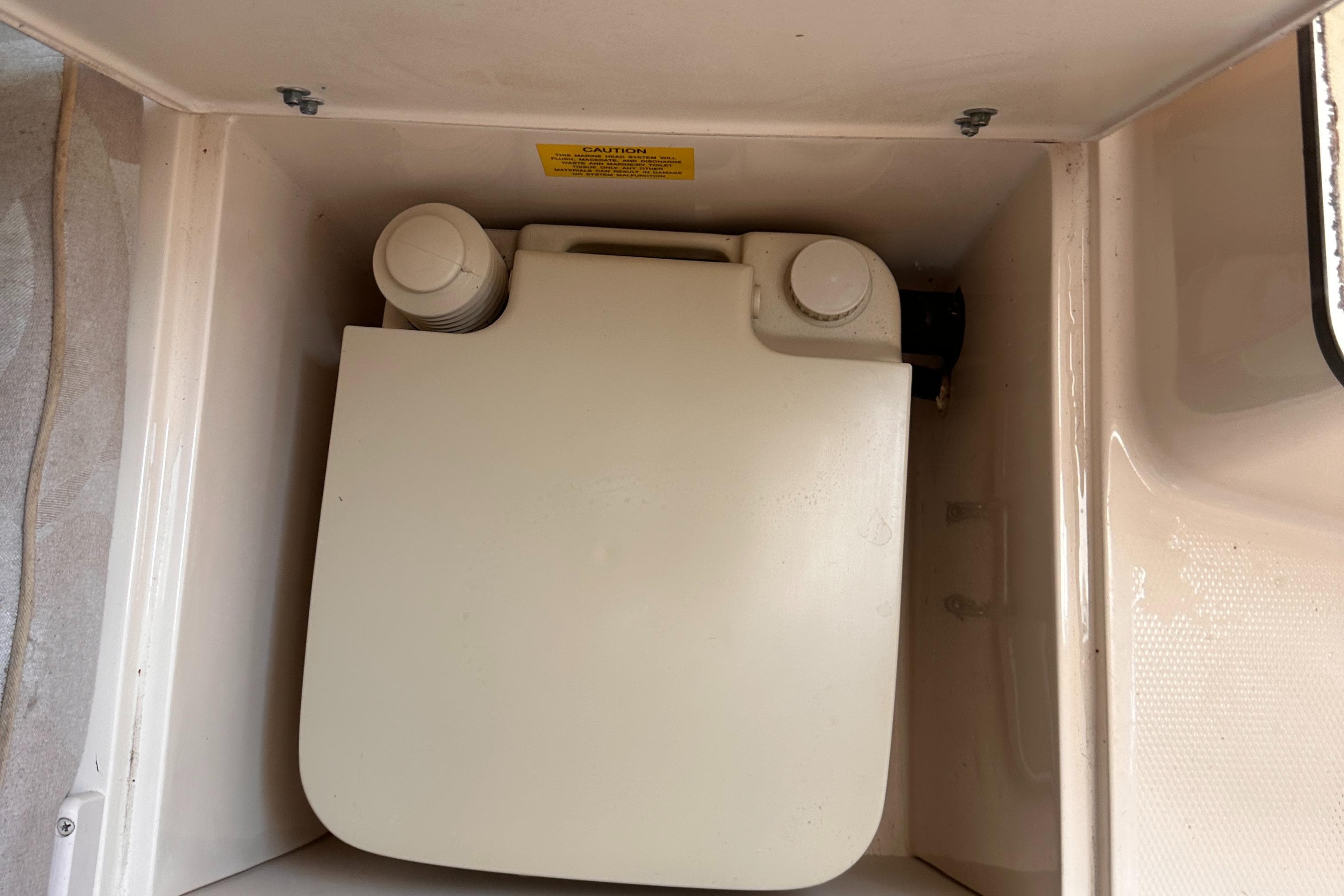Storage compartment in a 2004 Grady-White Gulfstream 232 boat.