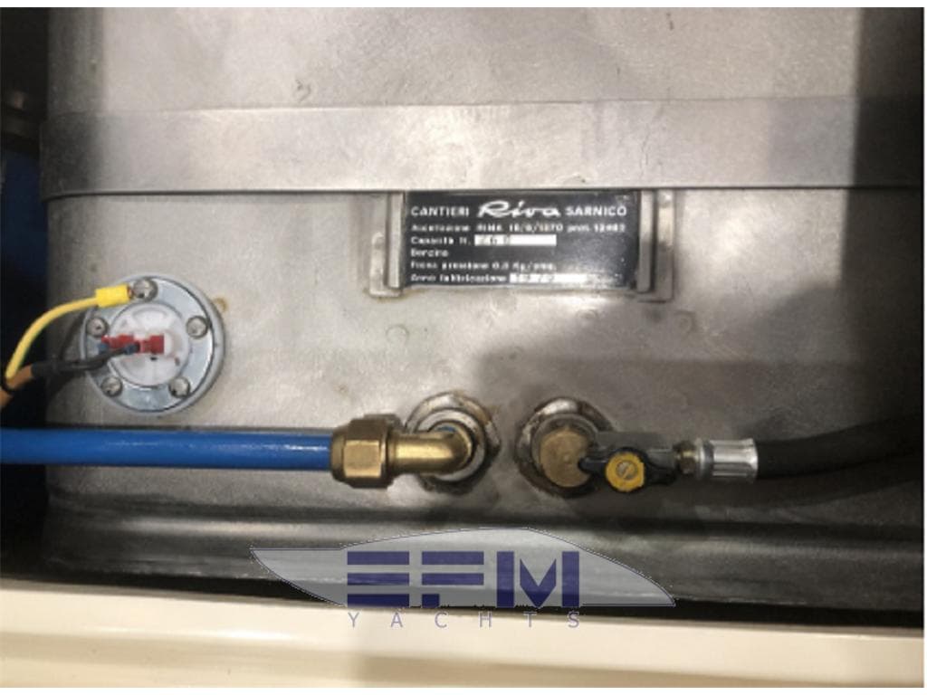 Engine compartment of 1980 Riva St Tropez yacht with visible labels and connections.